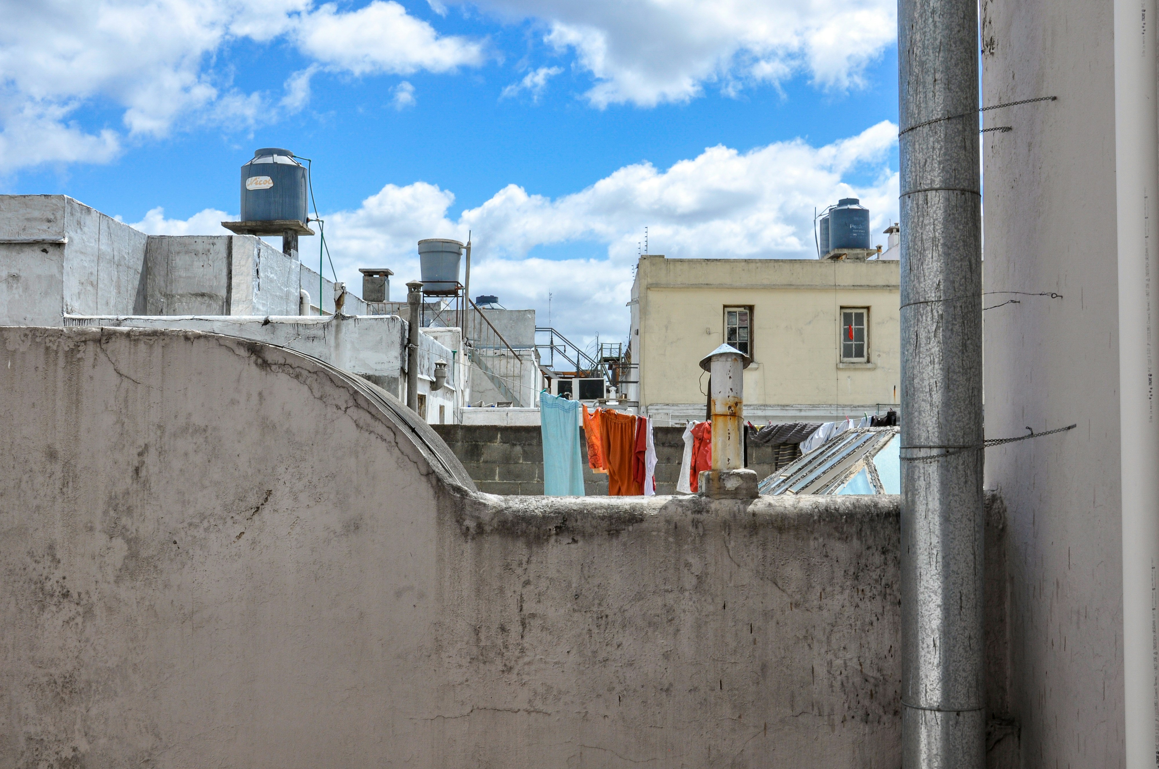 Rooftops with water tanks and laundry hanging