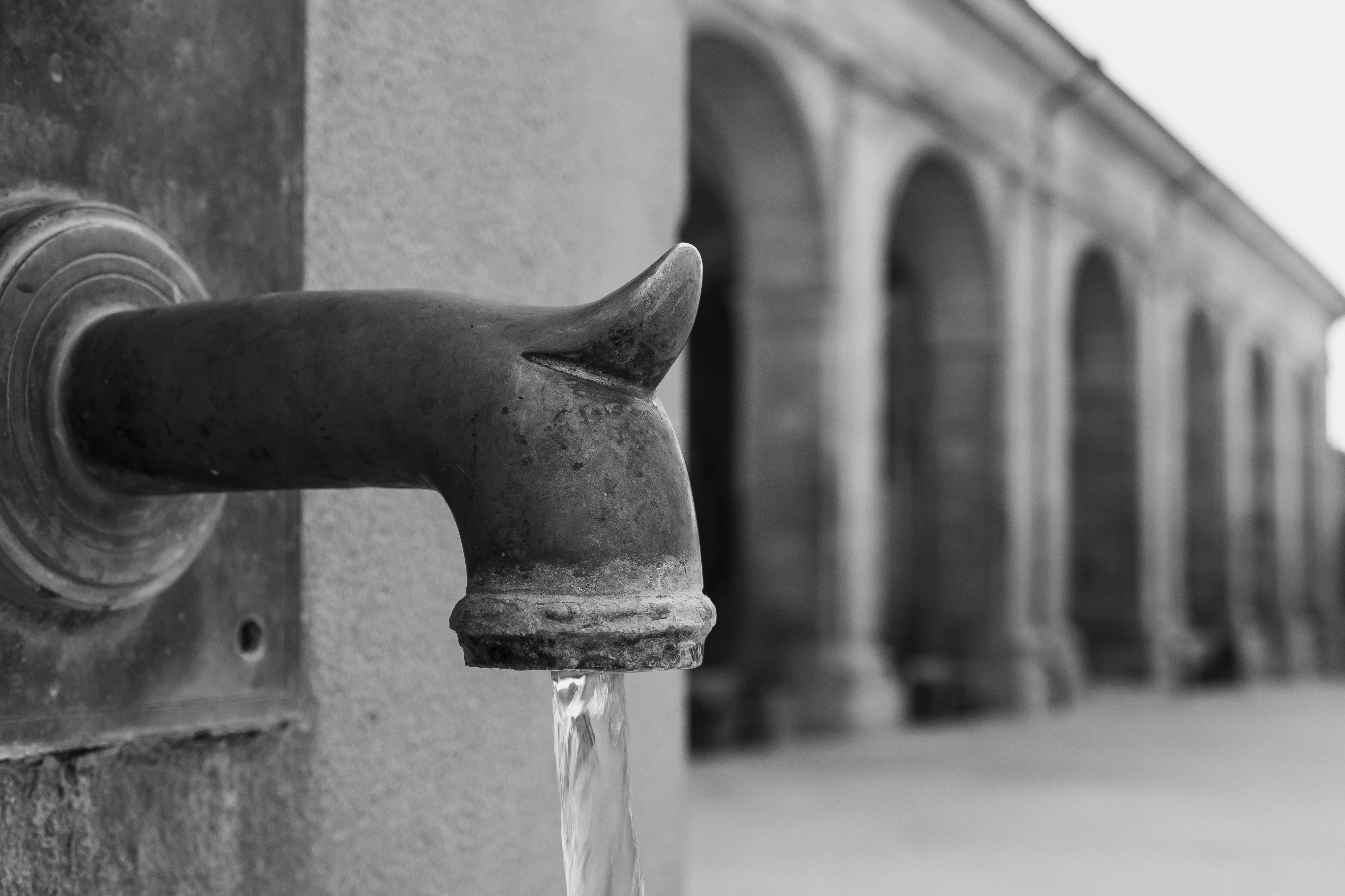 Water flowing from an old fountain spout