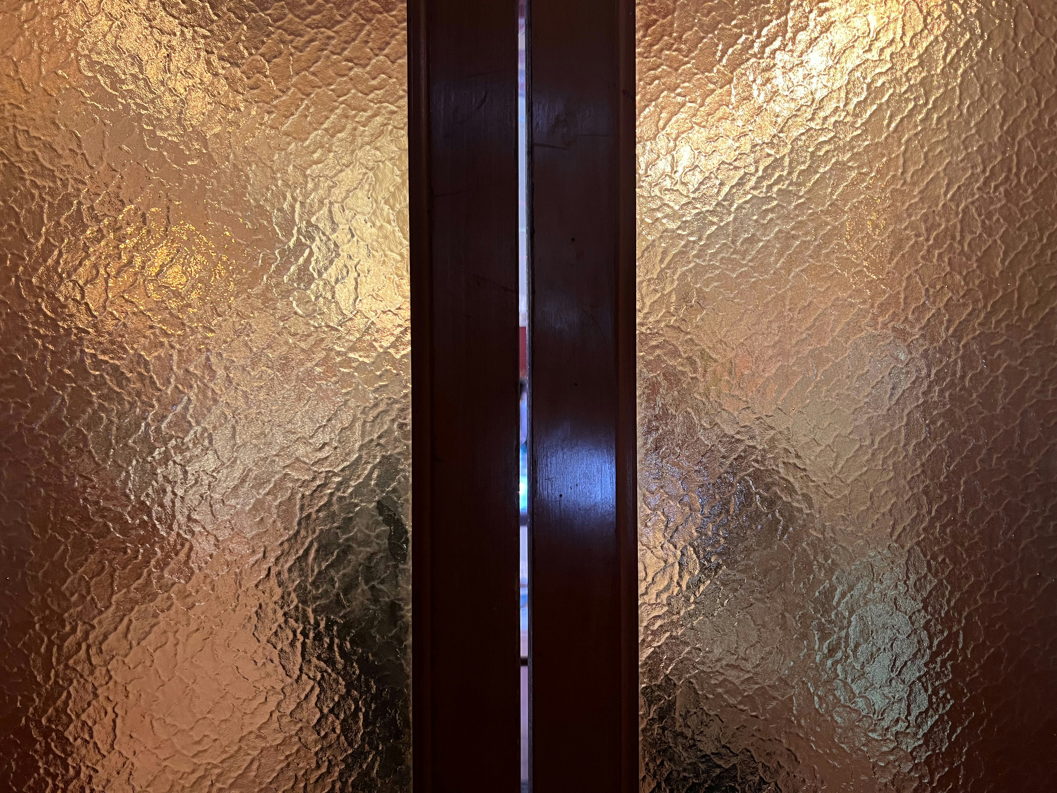 Textured glass panels with dark brown frame