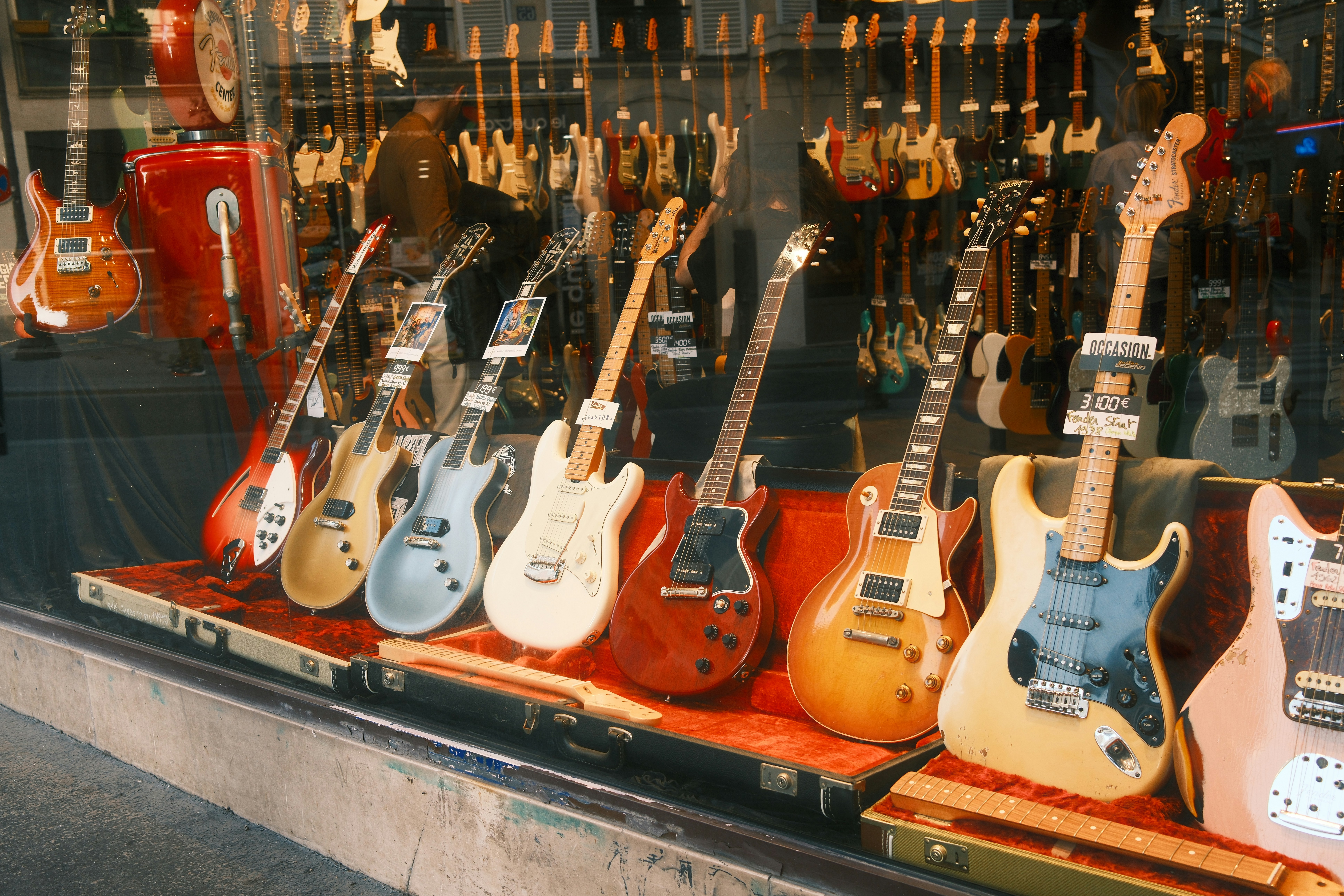 Guitars displayed in a store window