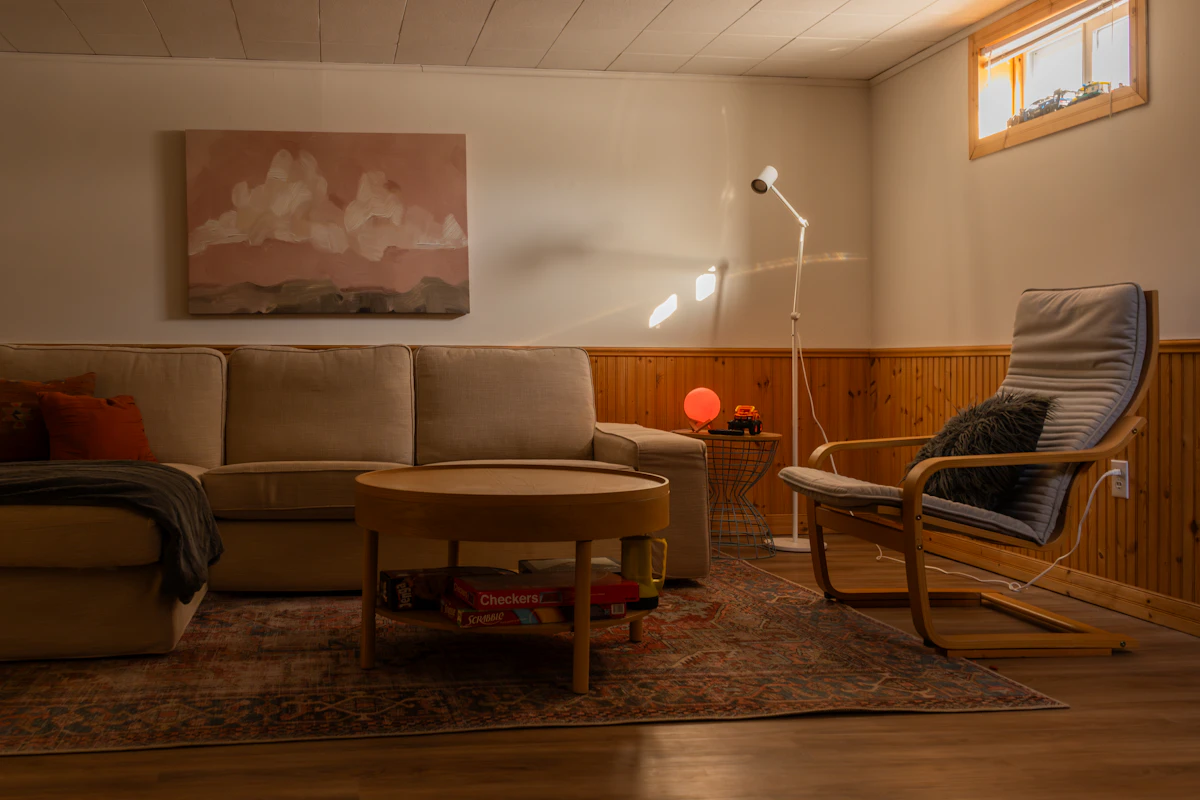 Cozy rented lounge in warm evening light with soft textiles