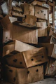 Pile of cardboard boxes stacked in a storage area.