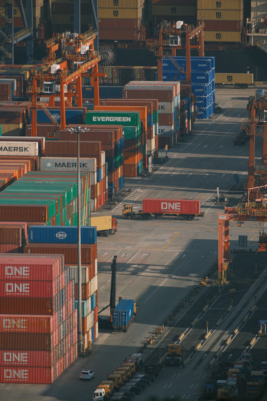 Shipping containers stacked at a busy international freight port