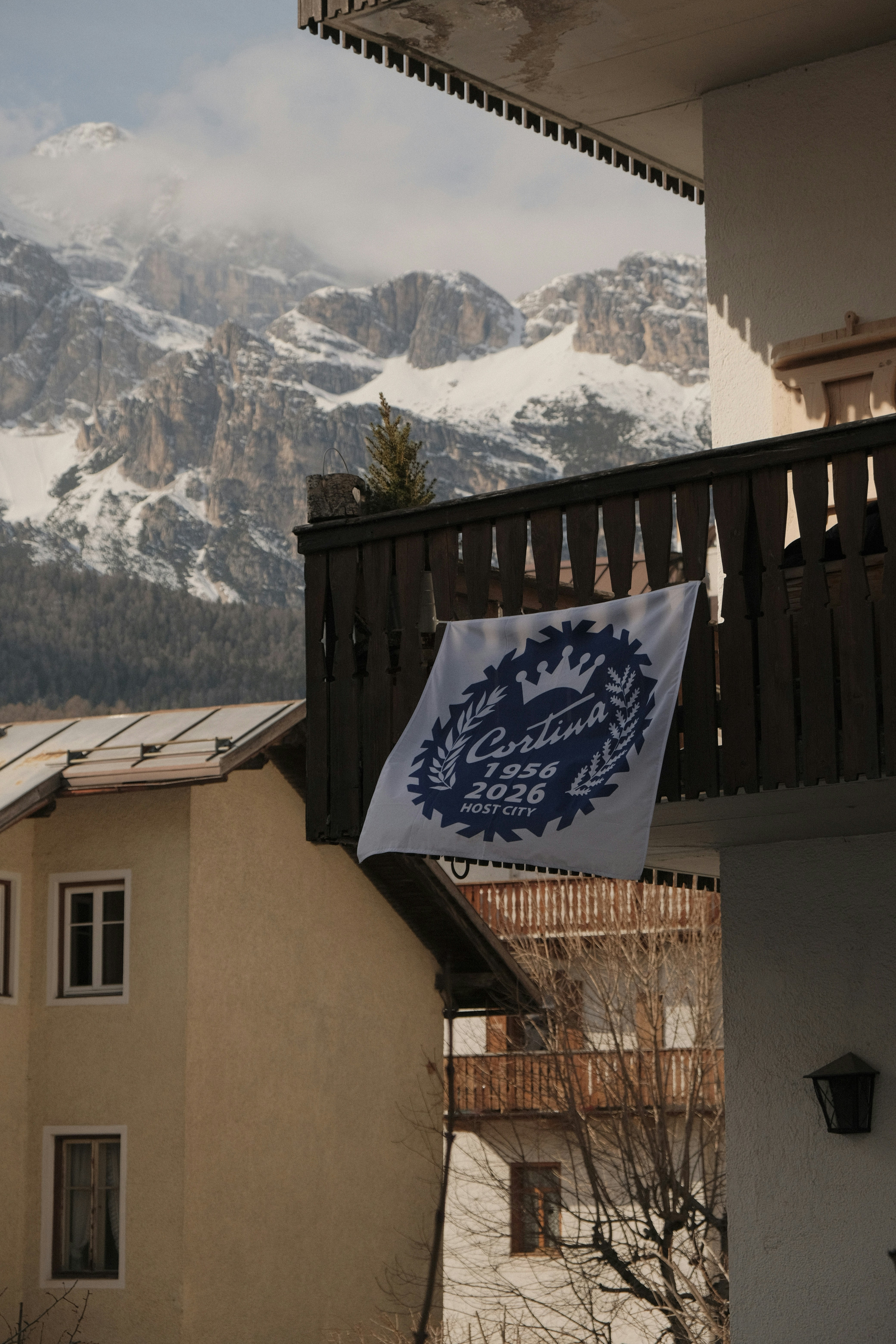 Flag on balcony with snowy mountains behind