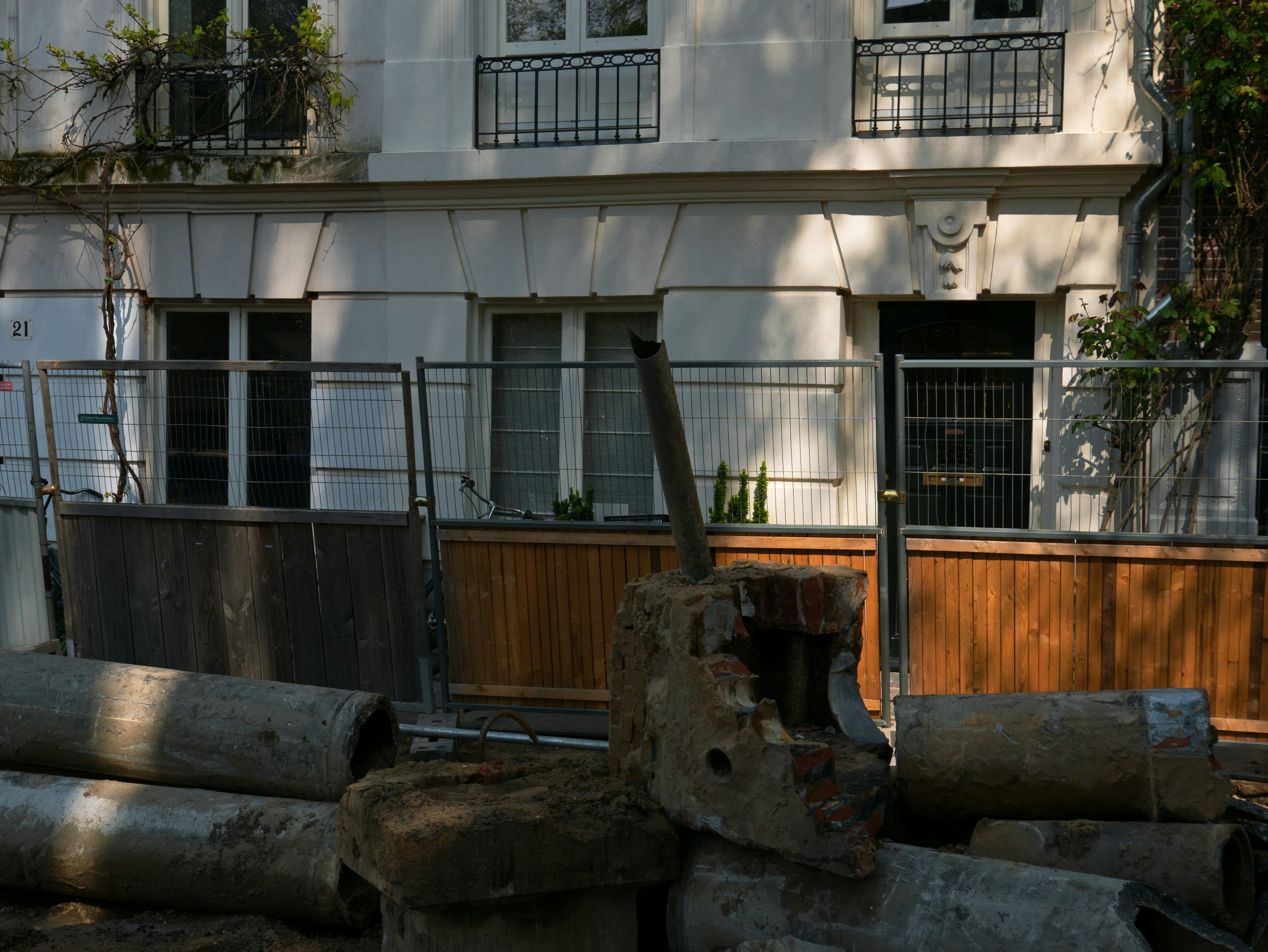 Building facade with construction materials in foreground