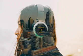 Double exposure of woman wearing headphones and city skyline.