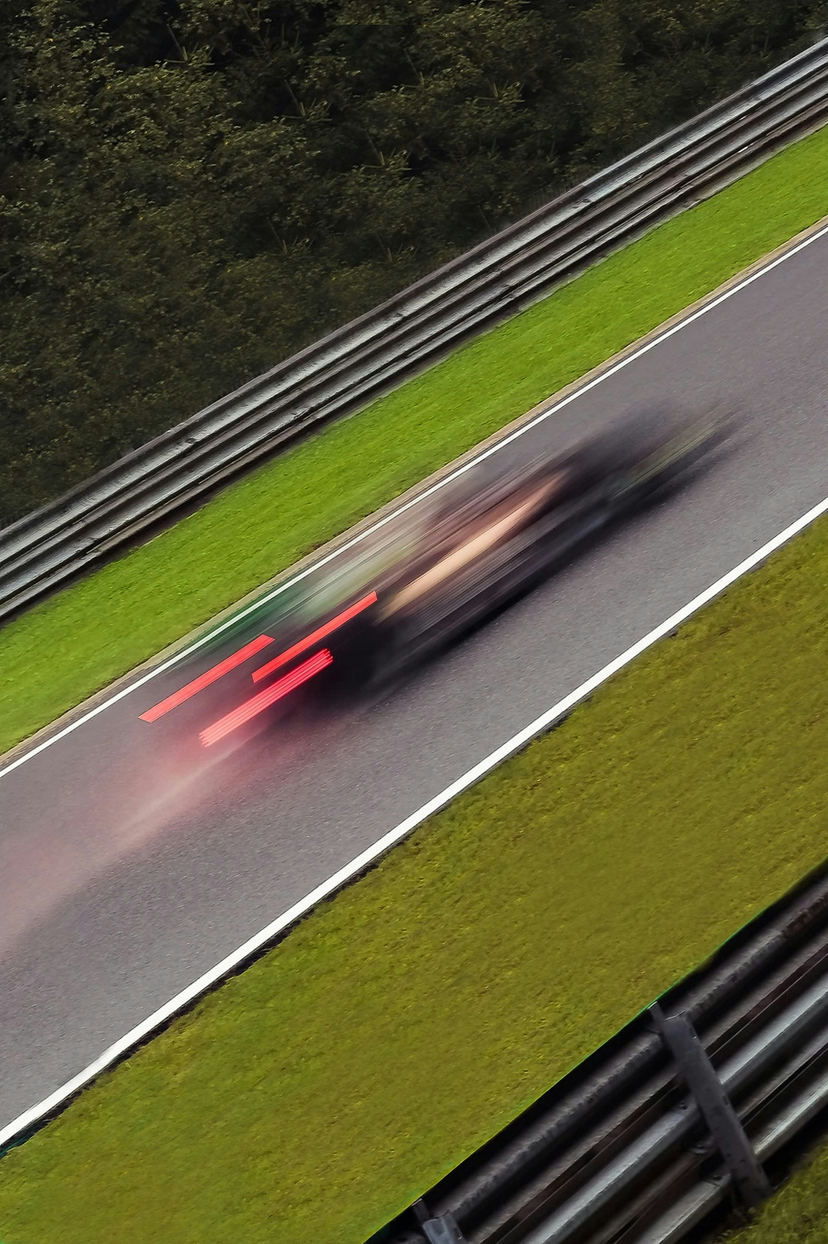 Race car speeding on track with motion blur