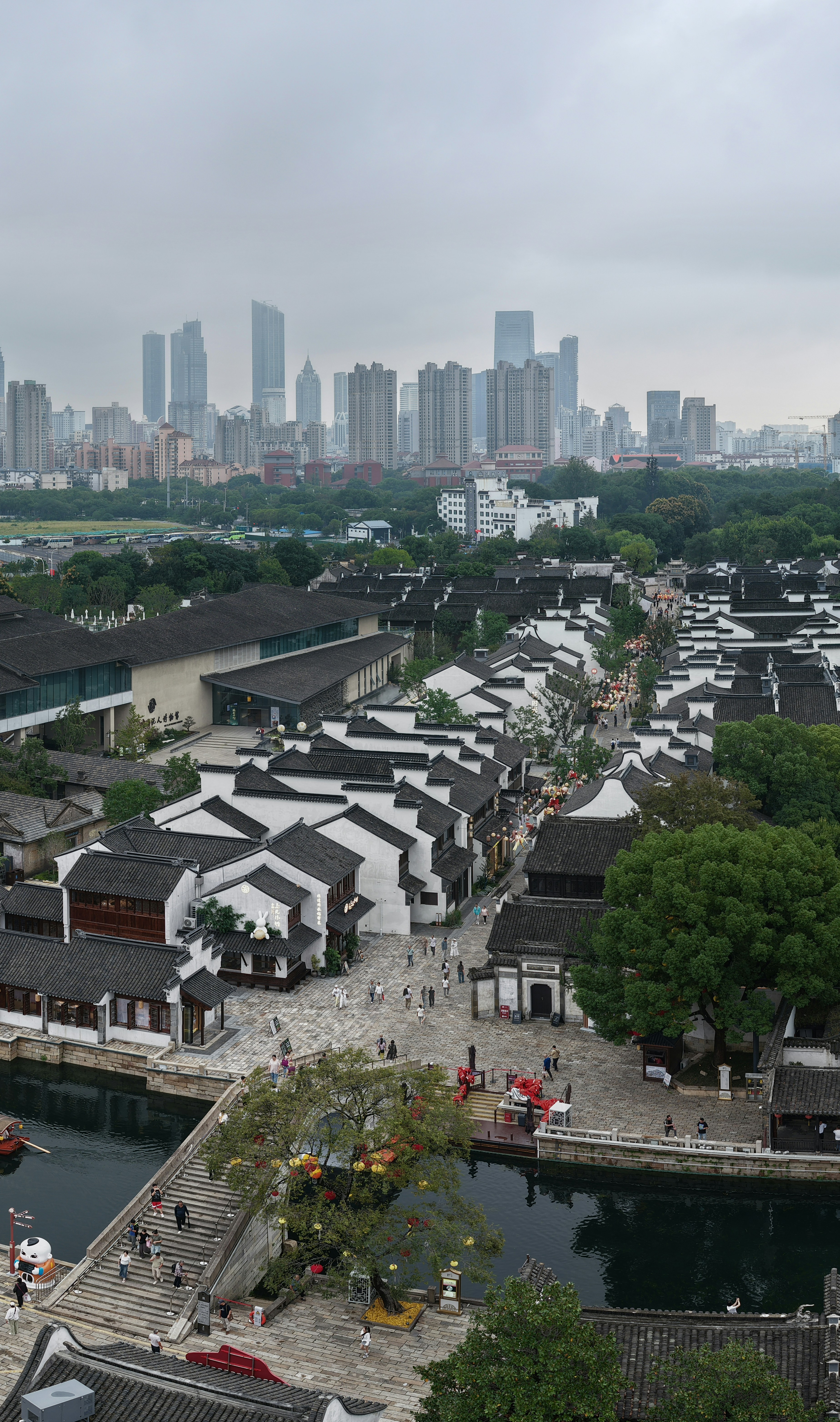 Traditional chinese village with modern city skyline background