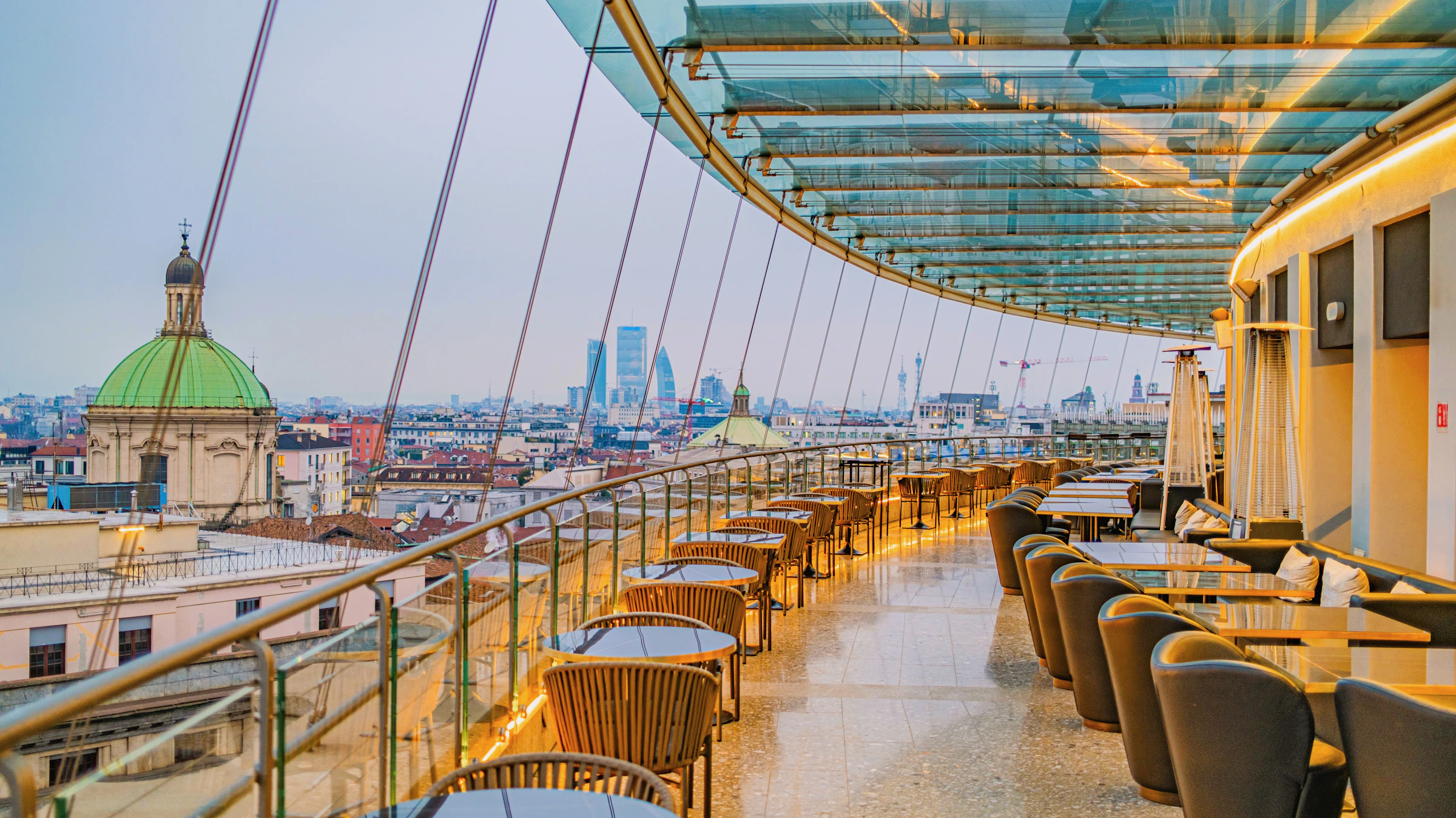 Refined rooftop restaurant prepared for blue-hour evening service