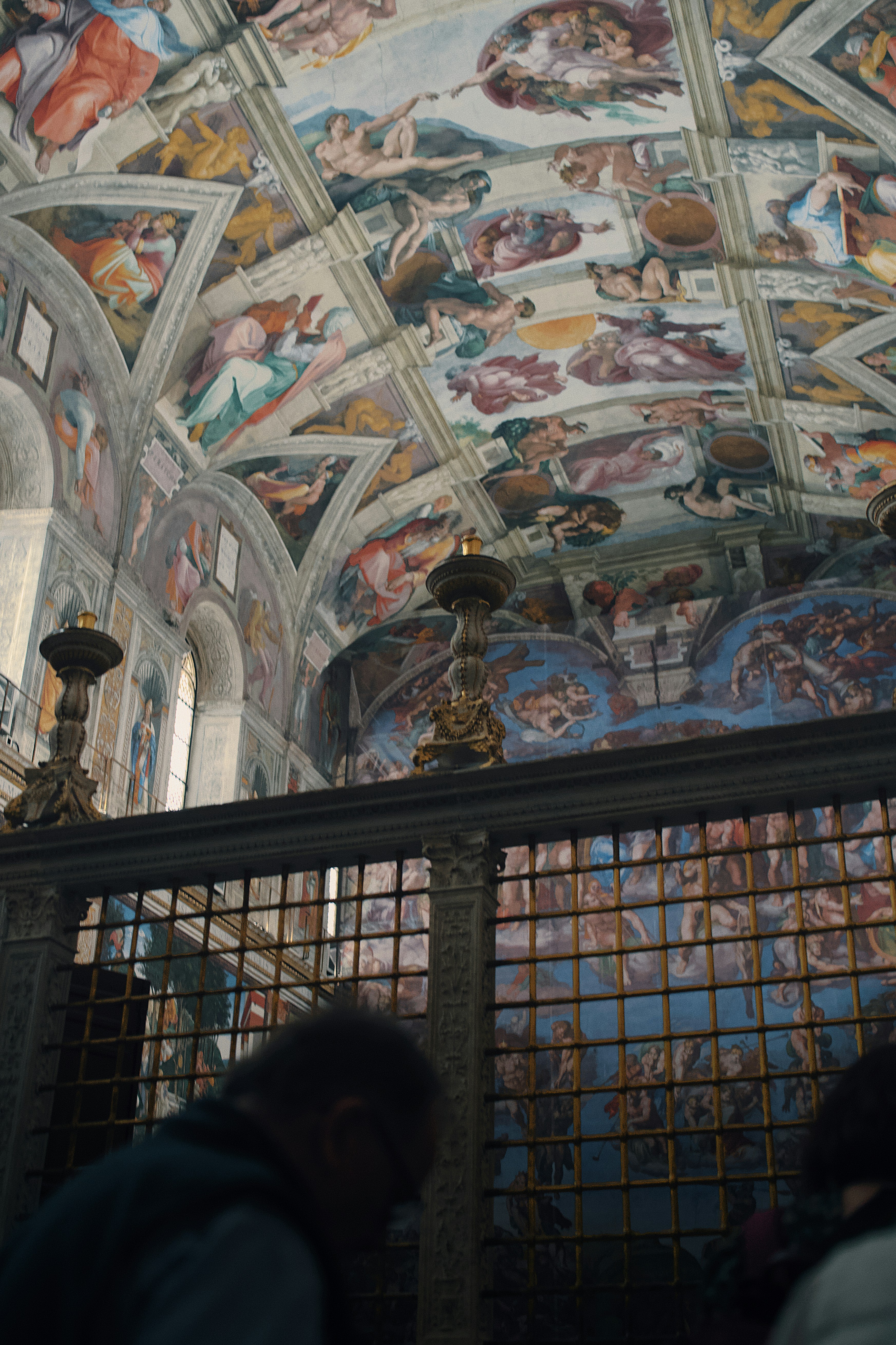 Sistine chapel ceiling frescoes with visitors below