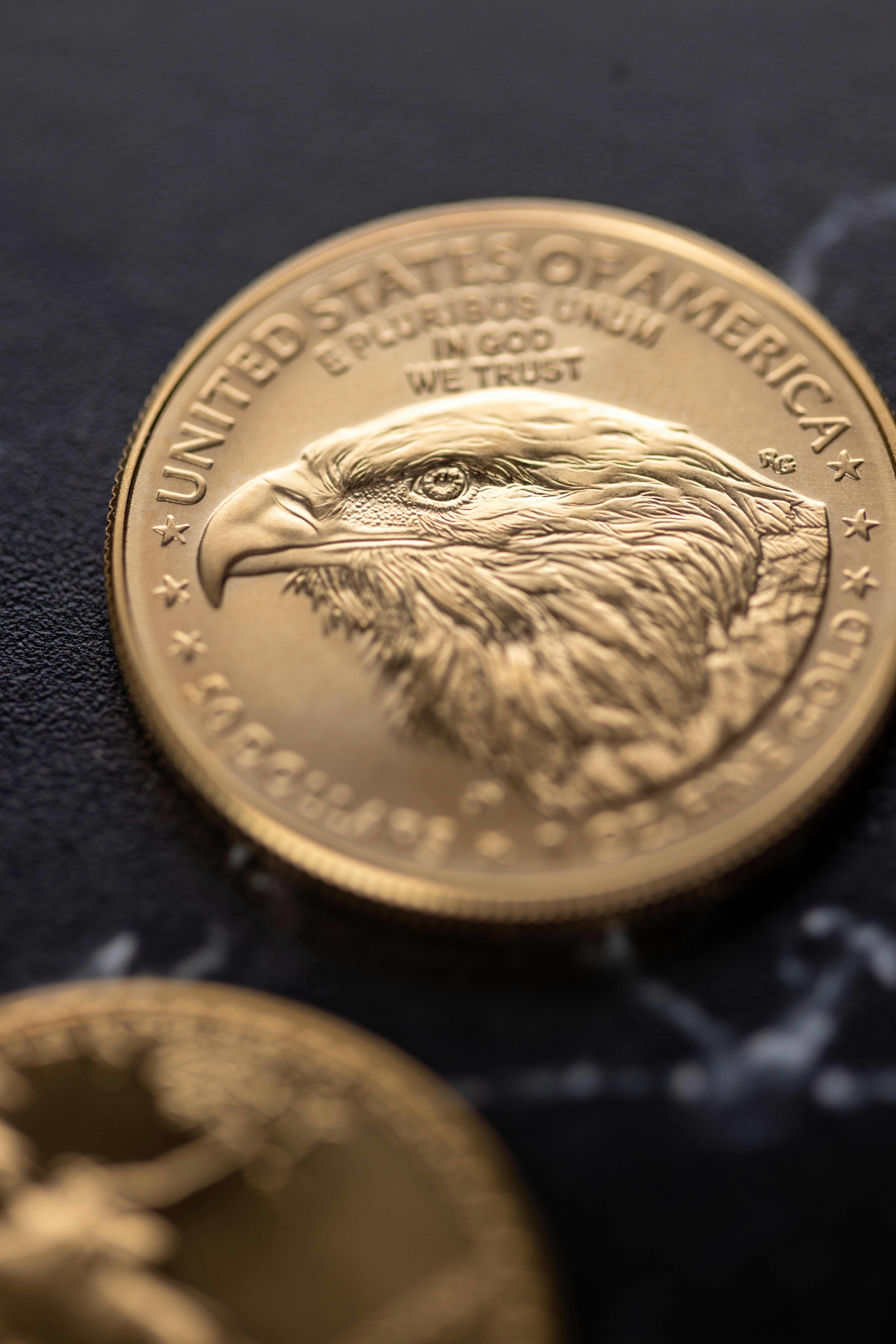 Golden american eagle coin with eagle portrait
