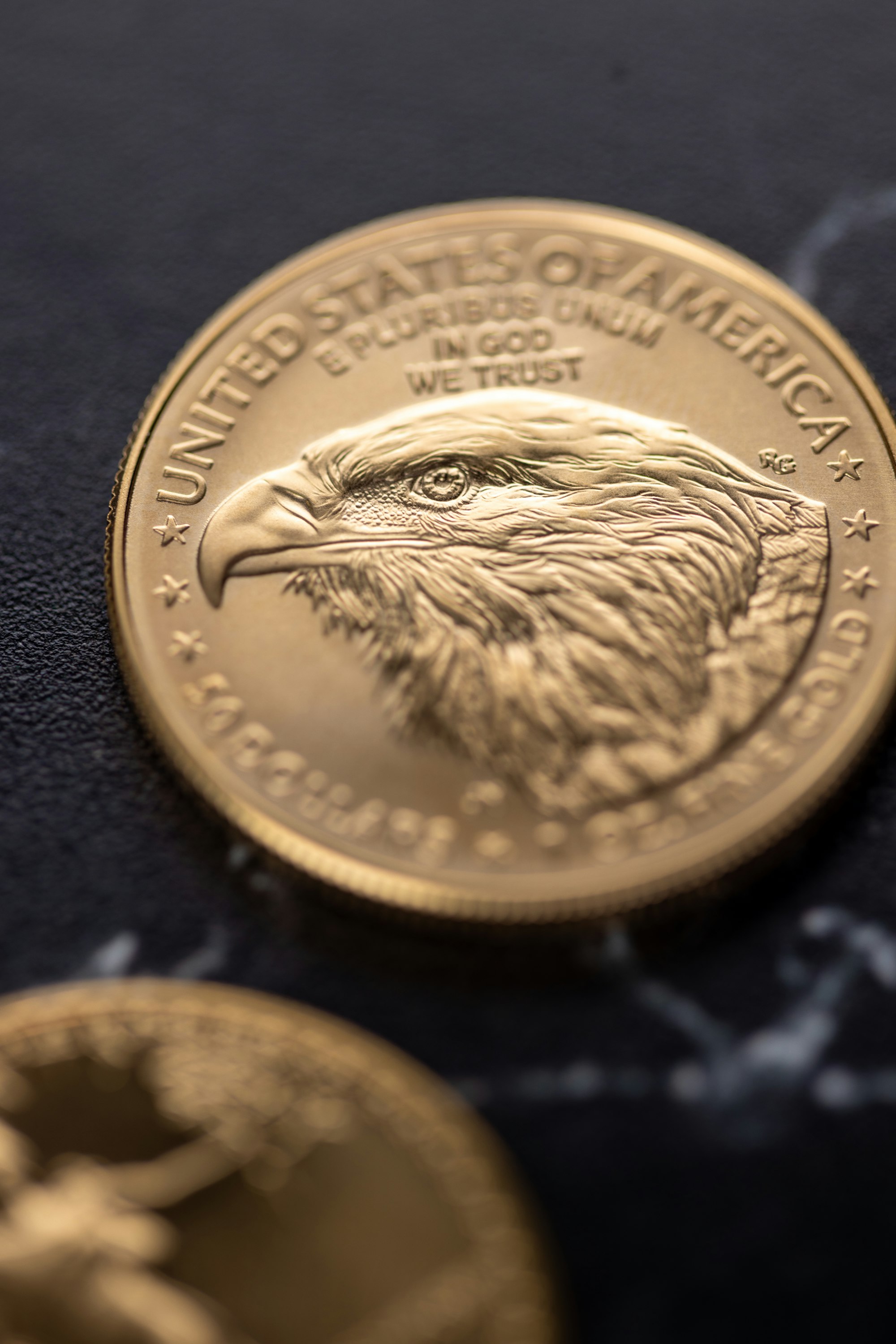 Golden american eagle coin with eagle portrait