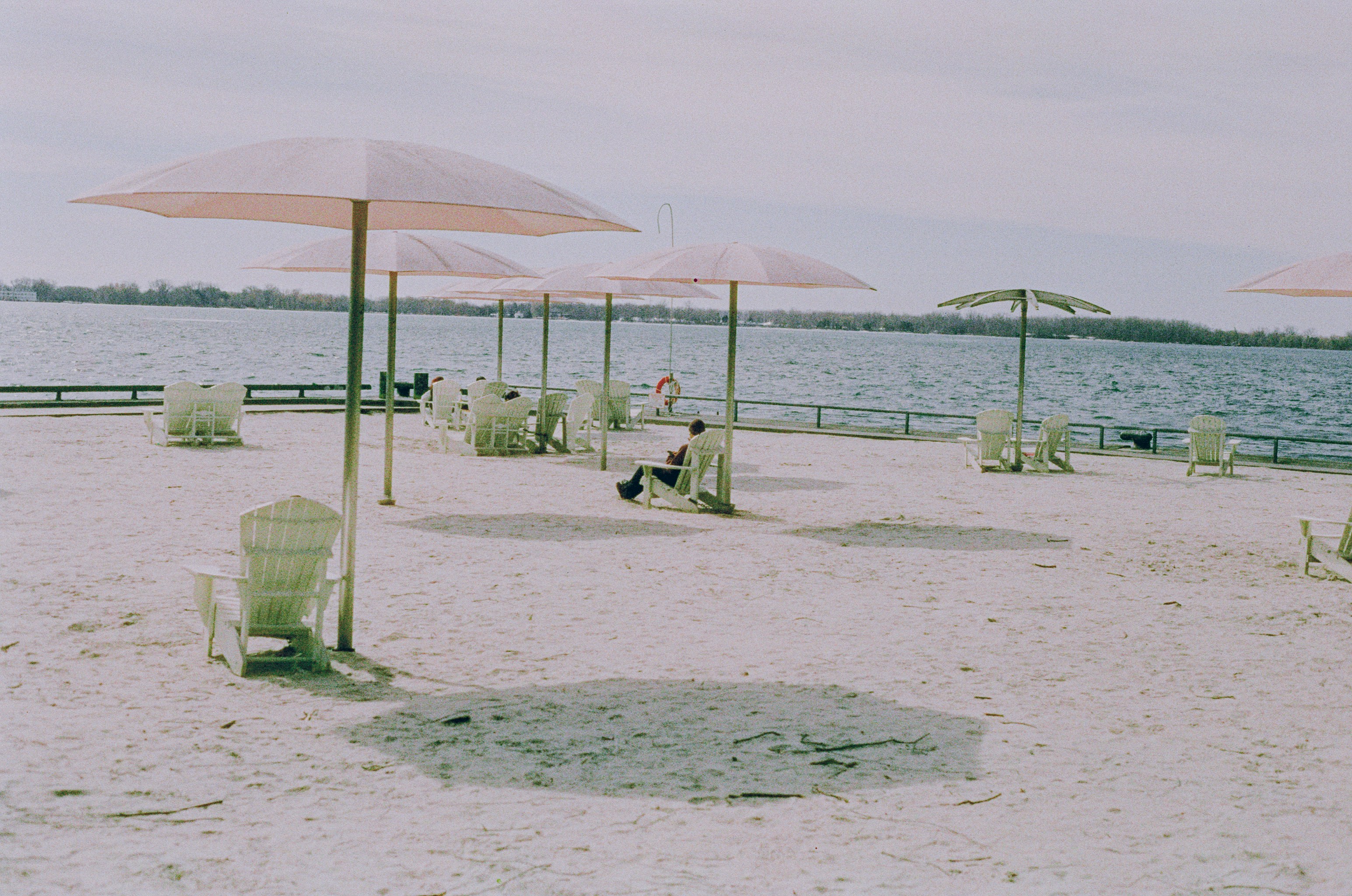Beach chairs and umbrellas on a sandy shore
