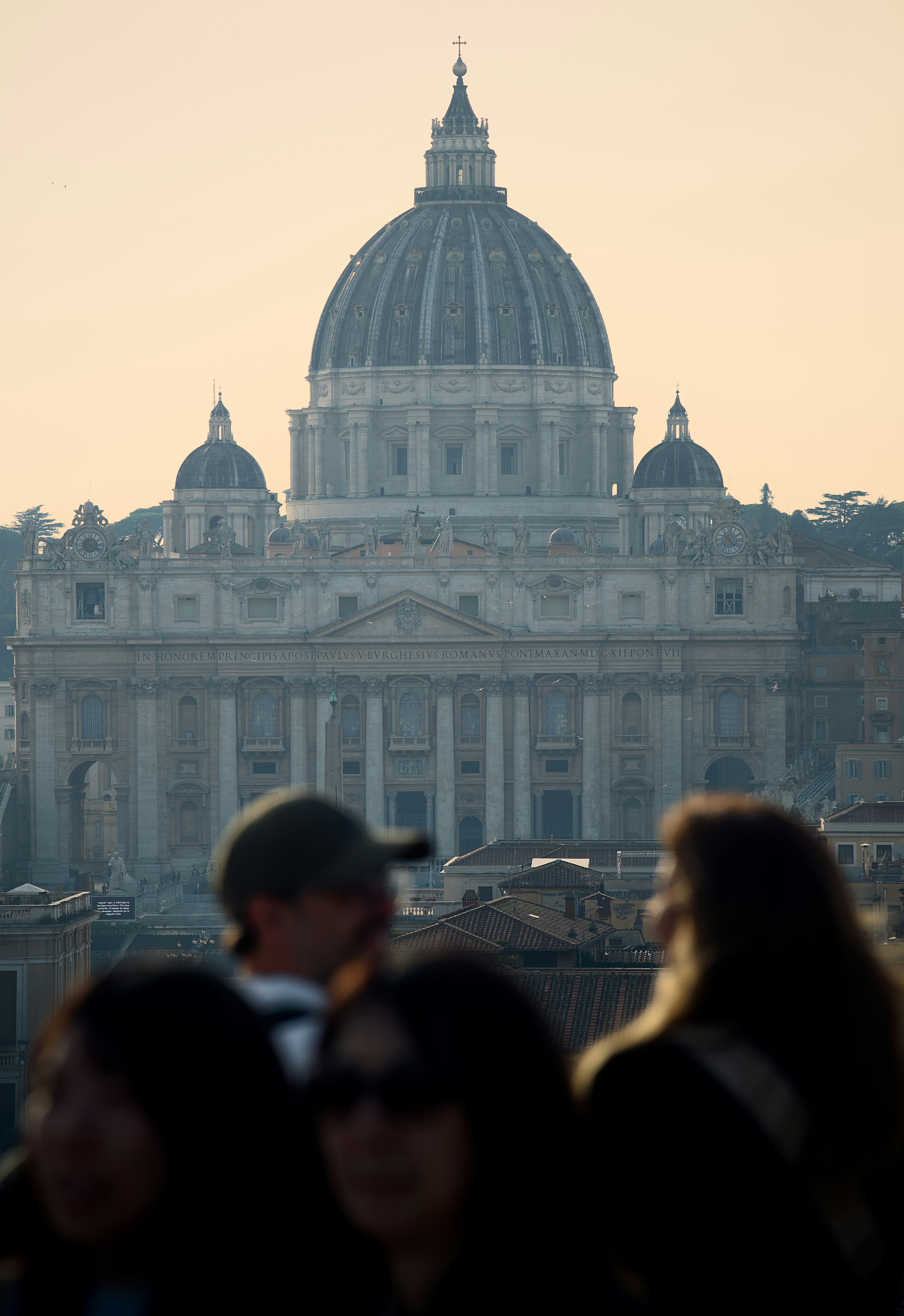 St. peter's basilica dome against a hazy sky