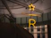 Neon star and letter r sign indoors
