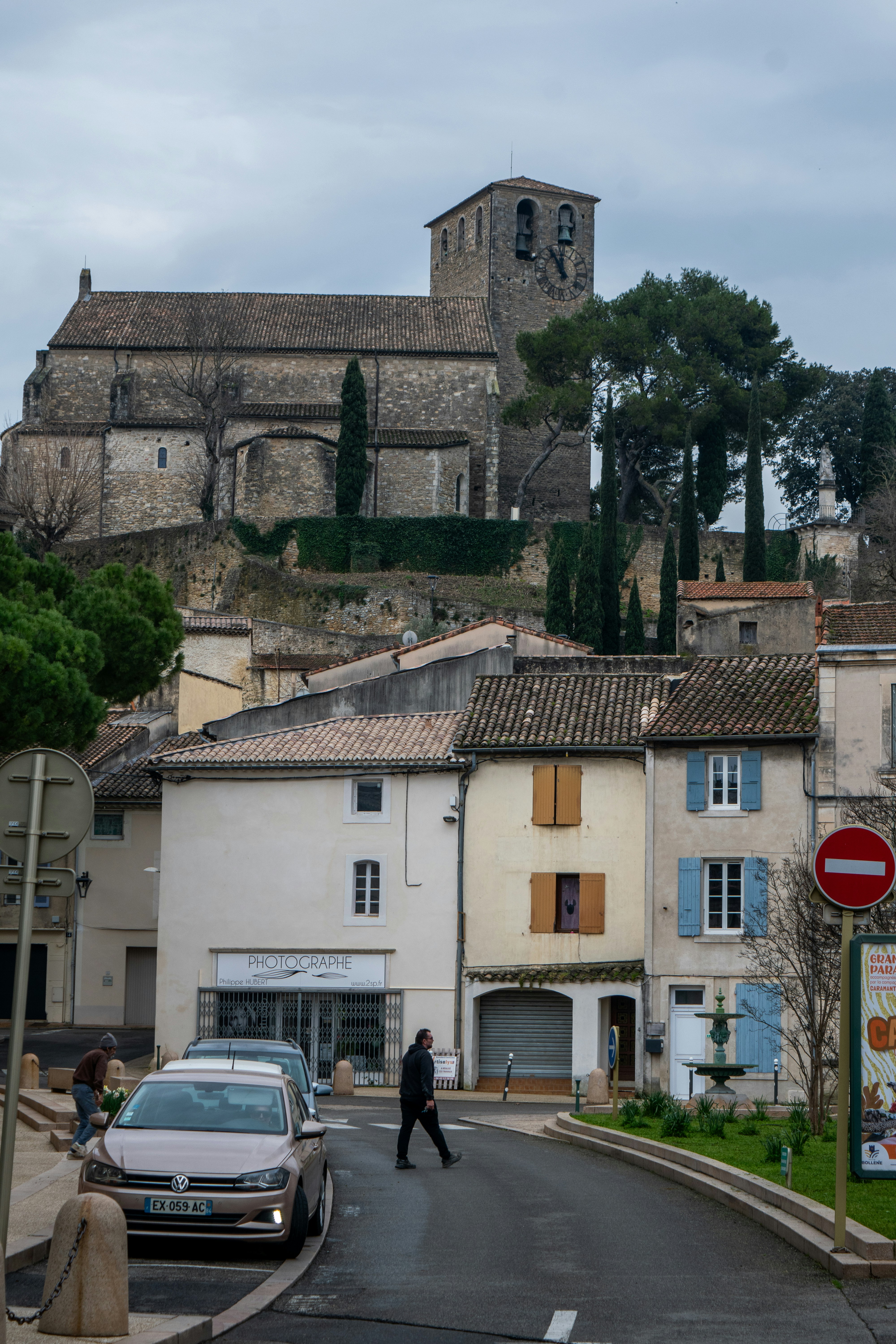 A european village street with historic church on hill.