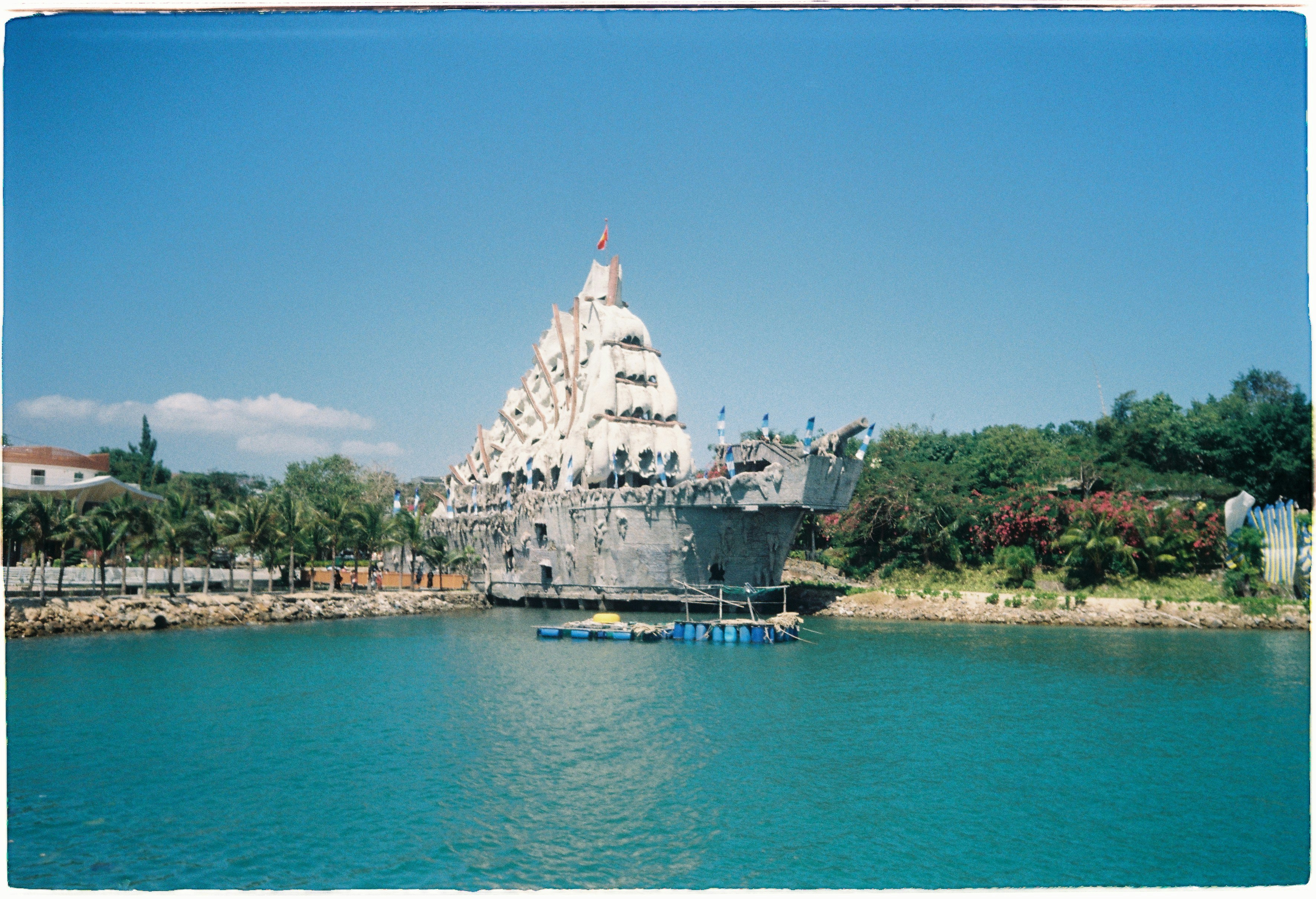 Unique building resembling a ship by the water