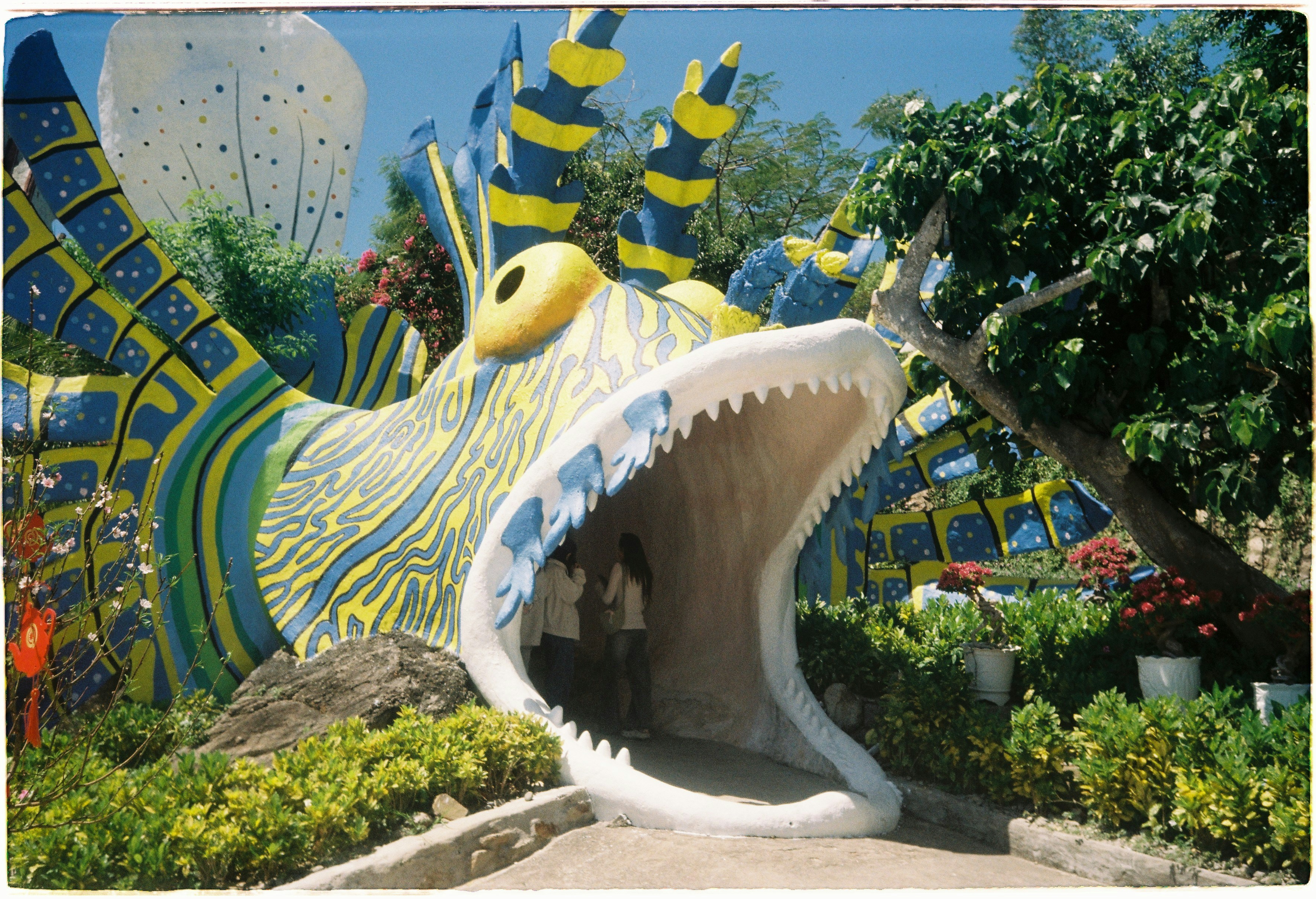 Whimsical monster entrance with open mouth and bright colors