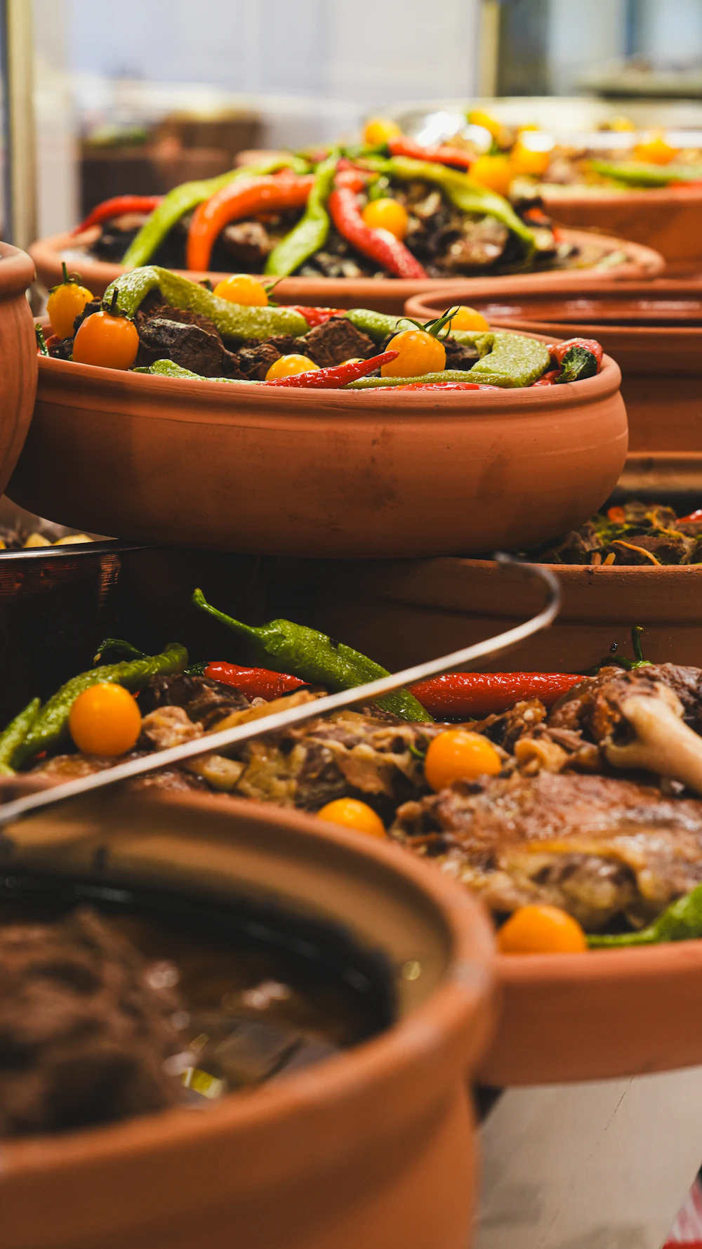 Clay tagine pots filled with Moroccan food