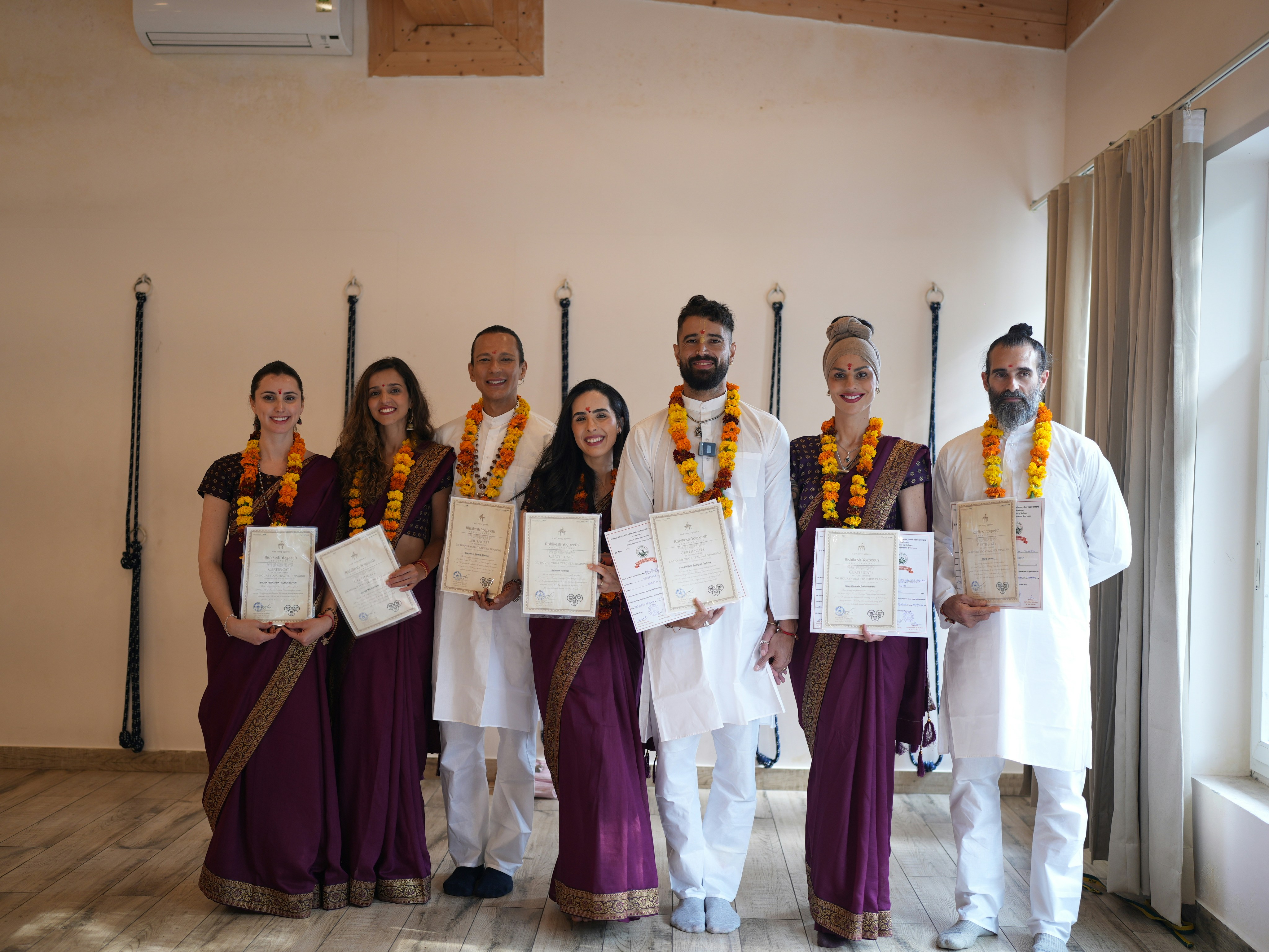 Group of people holding certificates at graduation