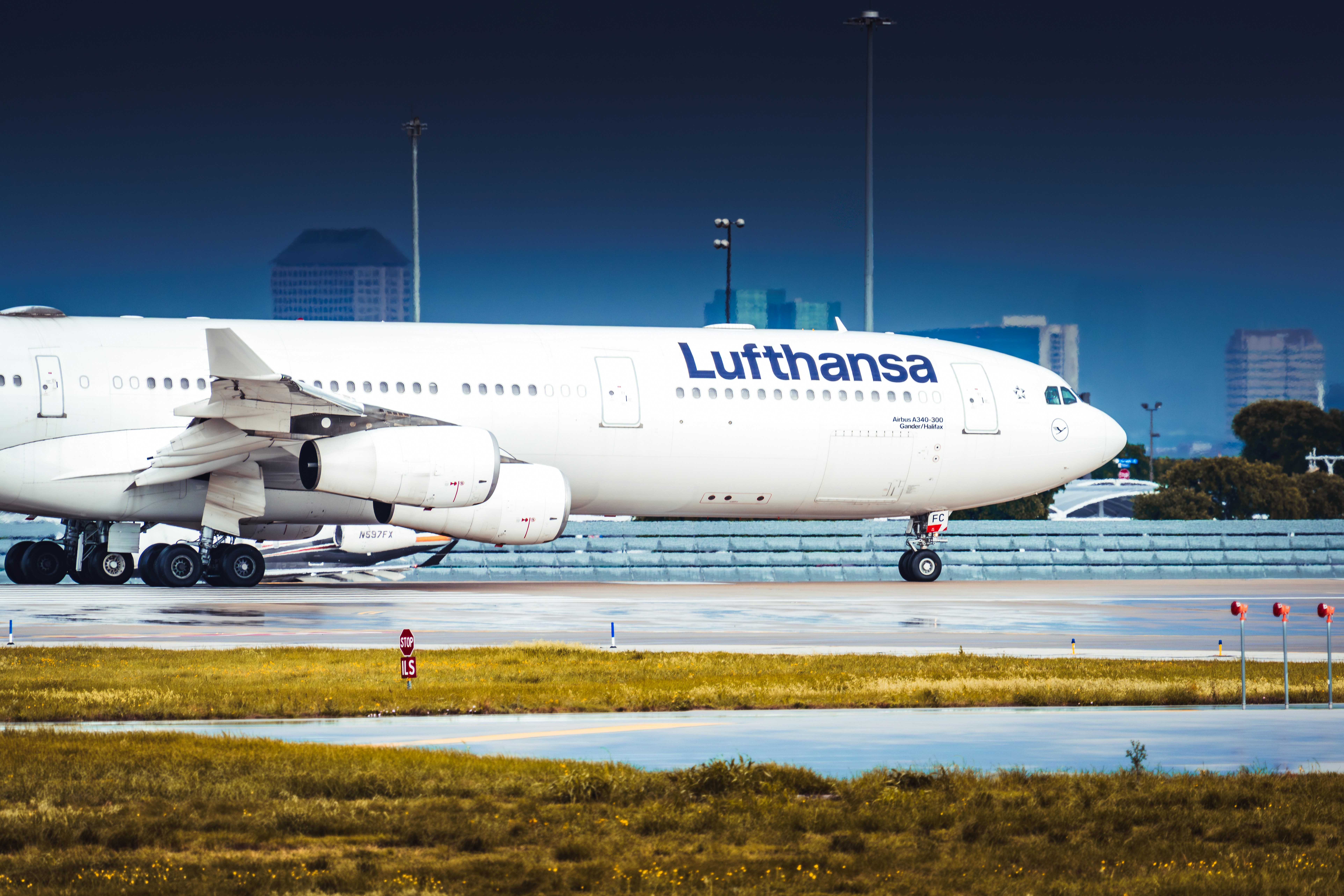 Lufthansa airplane on the tarmac at an airport.
