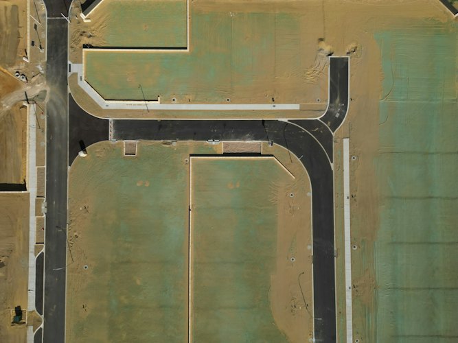Aerial view of newly graded and seeded subdivision lots