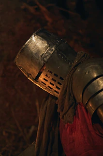 Knight in armor with helmet and red tunic