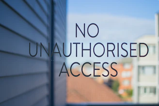 No unauthorised access sign on glass door