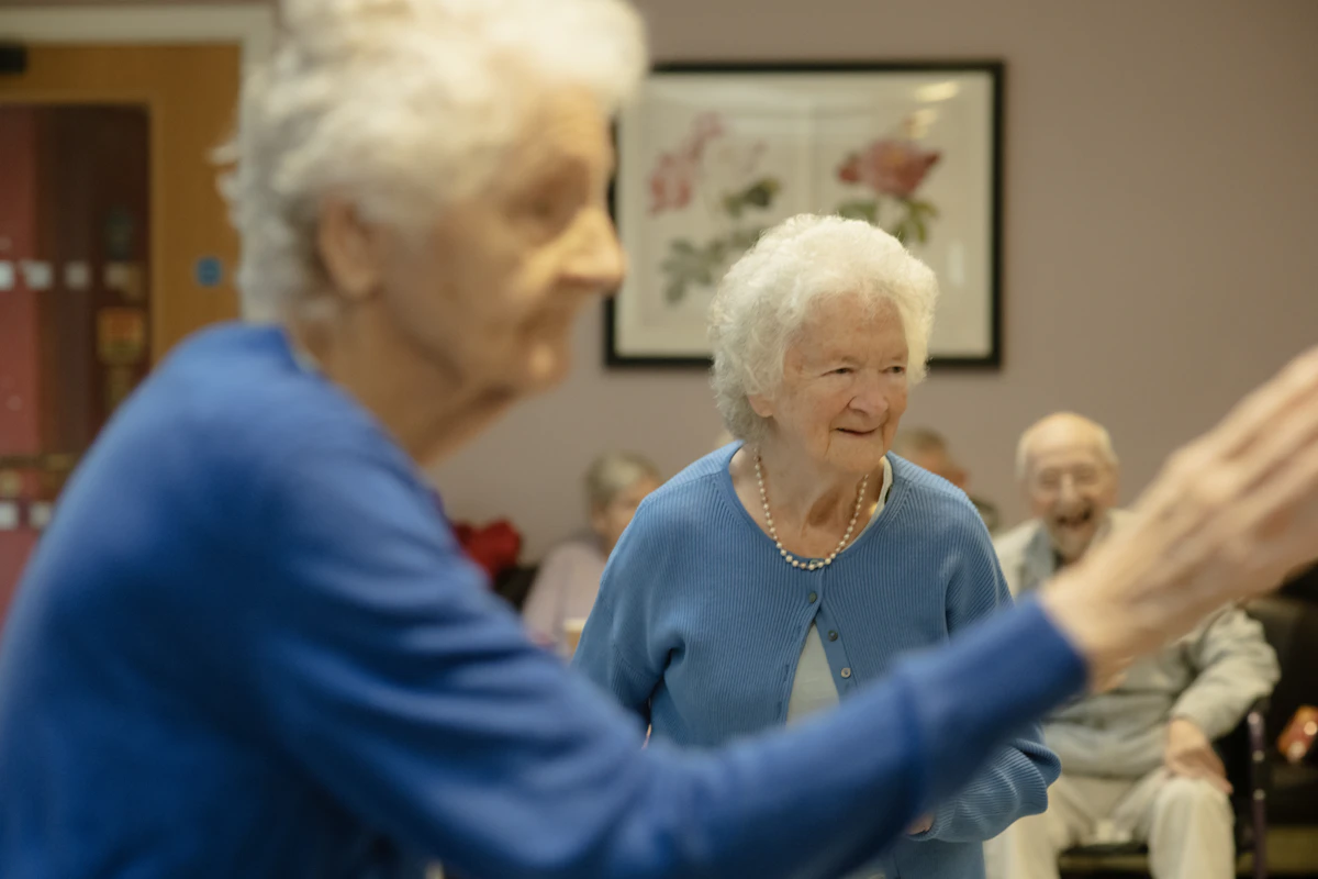 Older adults participating together in a supportive group activity