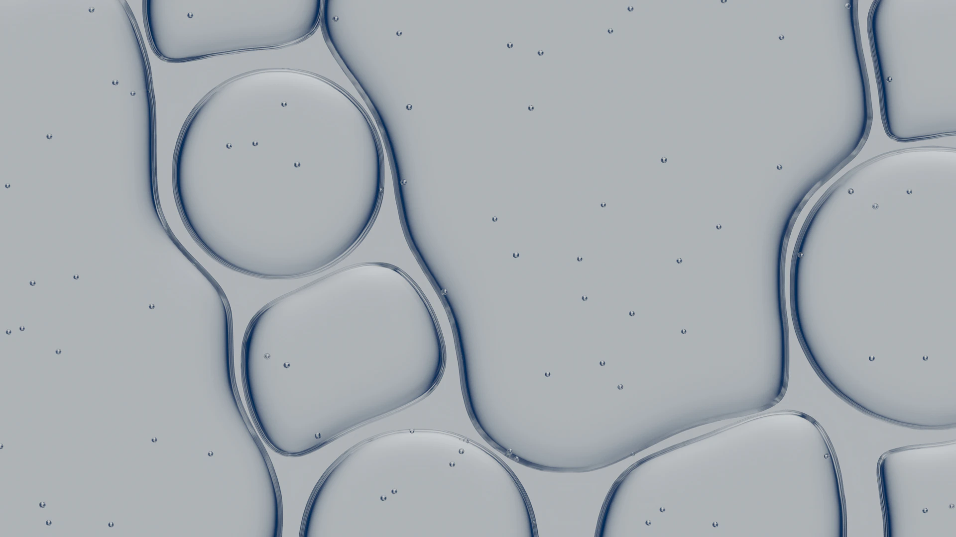 Abstract pattern of liquid bubbles with small particles.