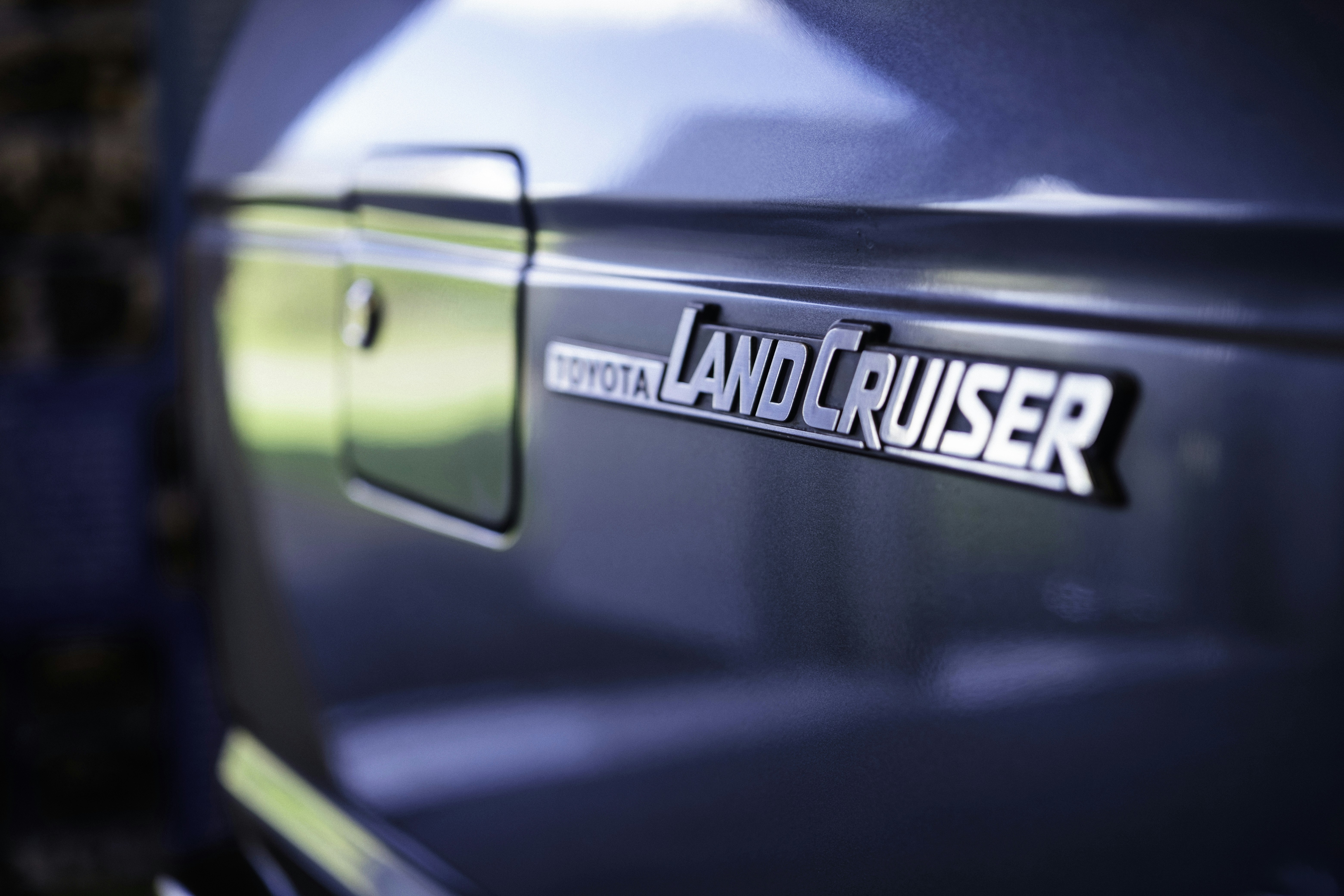 Toyota land cruiser emblem on a blue vehicle
