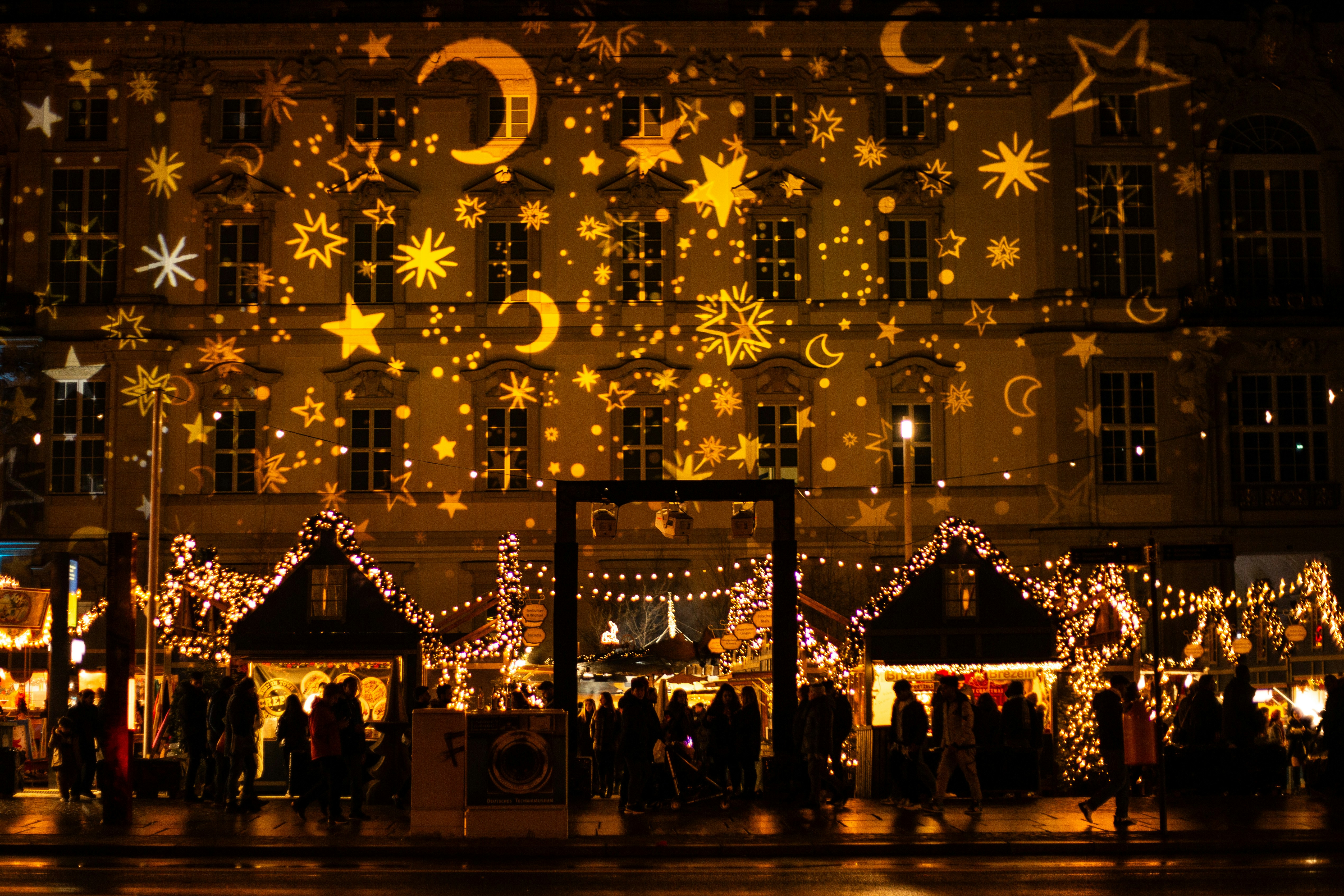 building facade illuminated with moon and stars