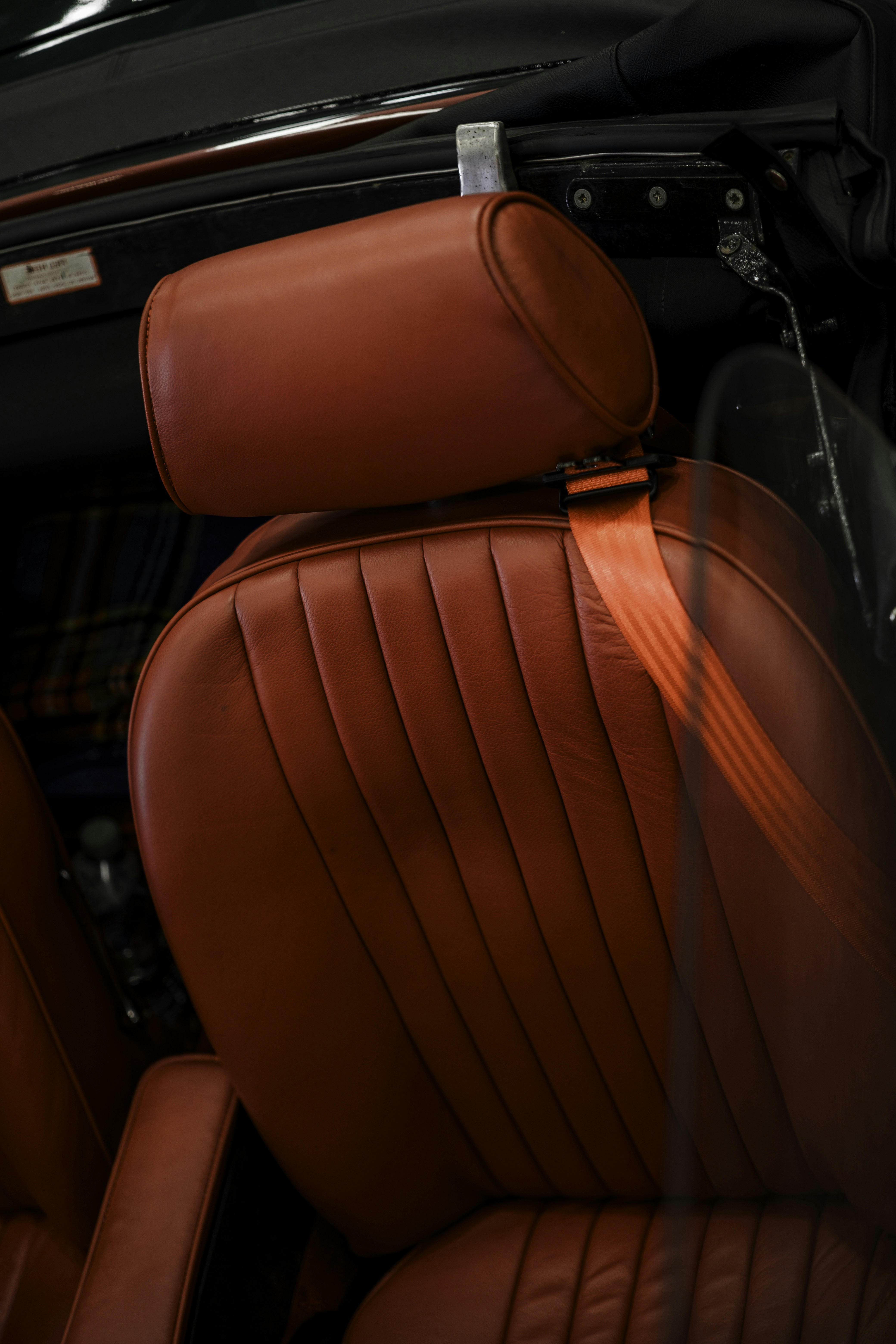Red leather car seats with seatbelt