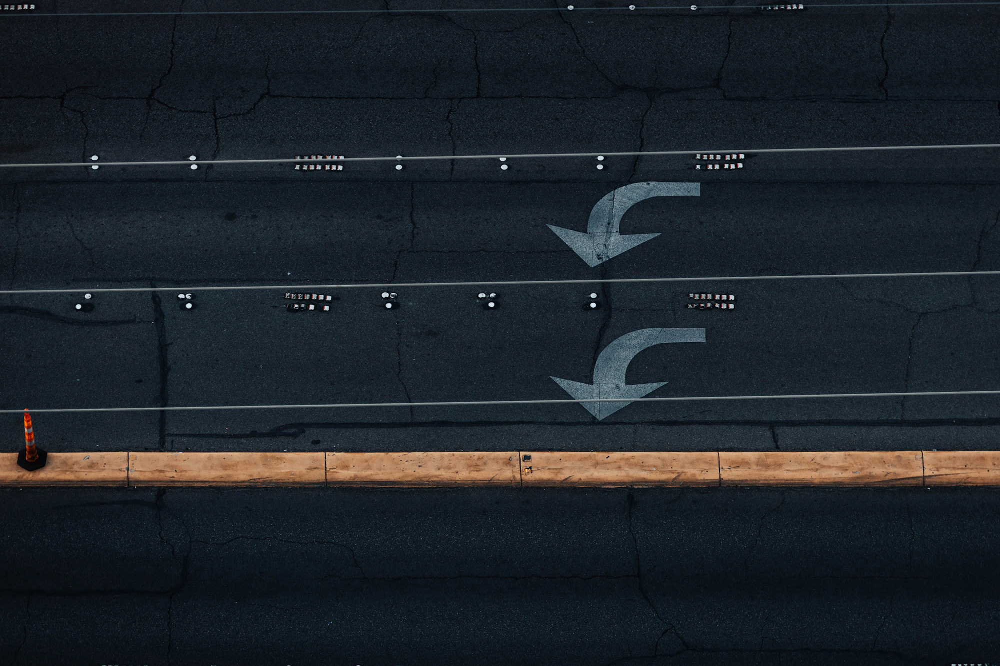 Road markings with arrows pointing in different directions viewed from above