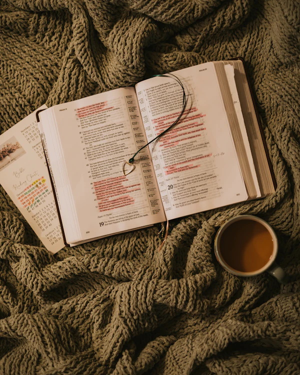 Open book with coffee cup and a calendar, generational planning is a series of small Tuesdays