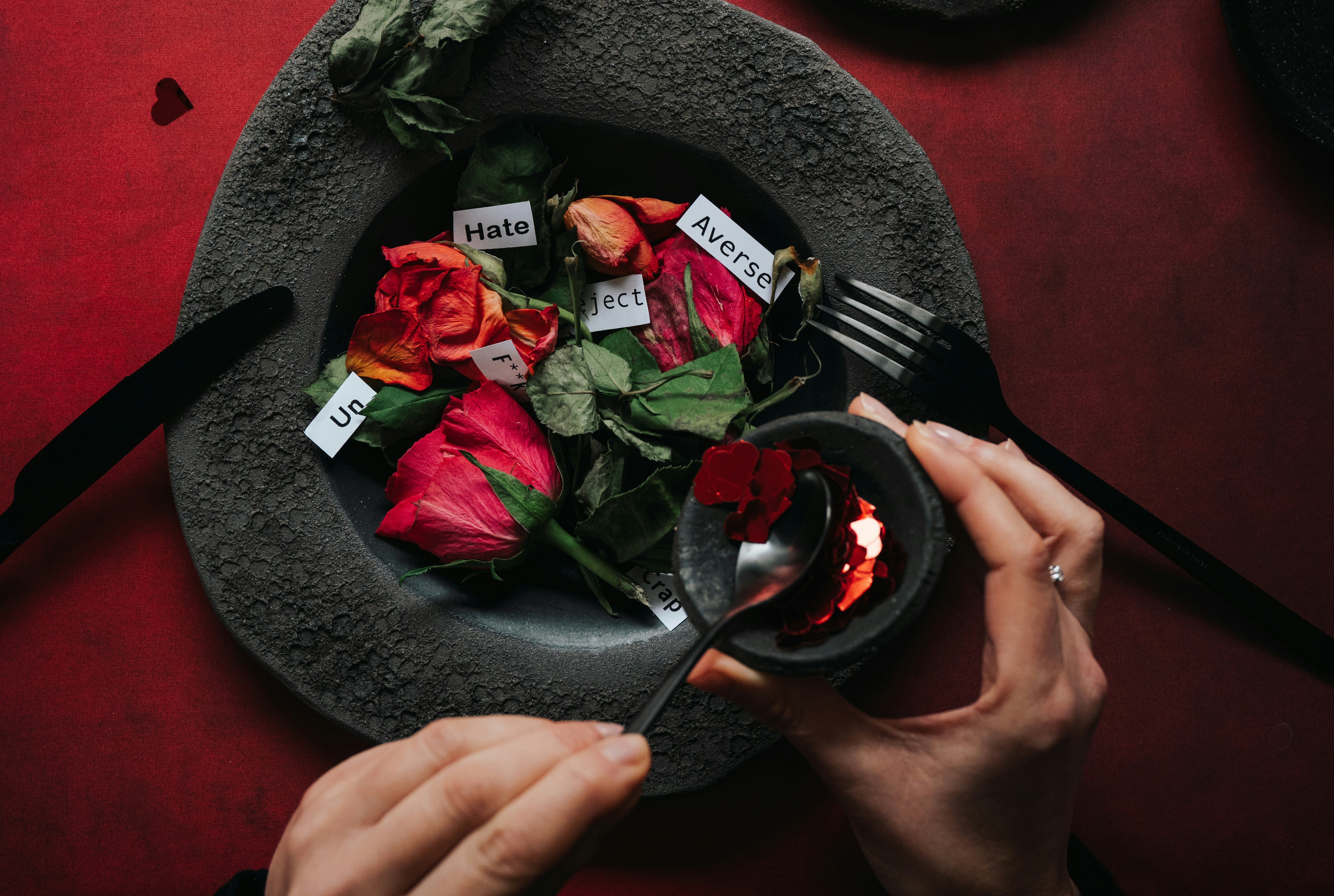 Dried roses with labels on a plate, being served.