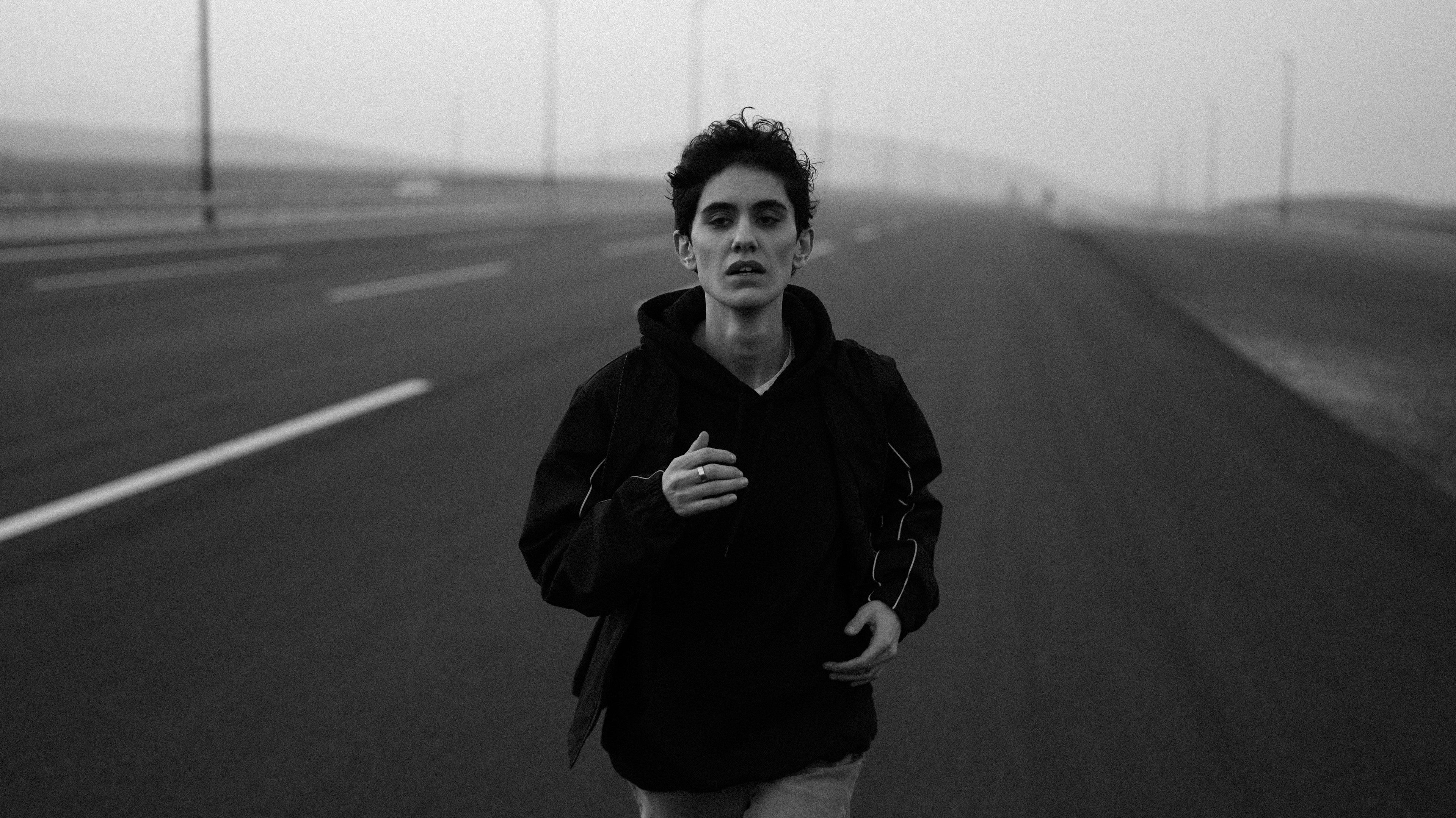 A person running on a deserted road