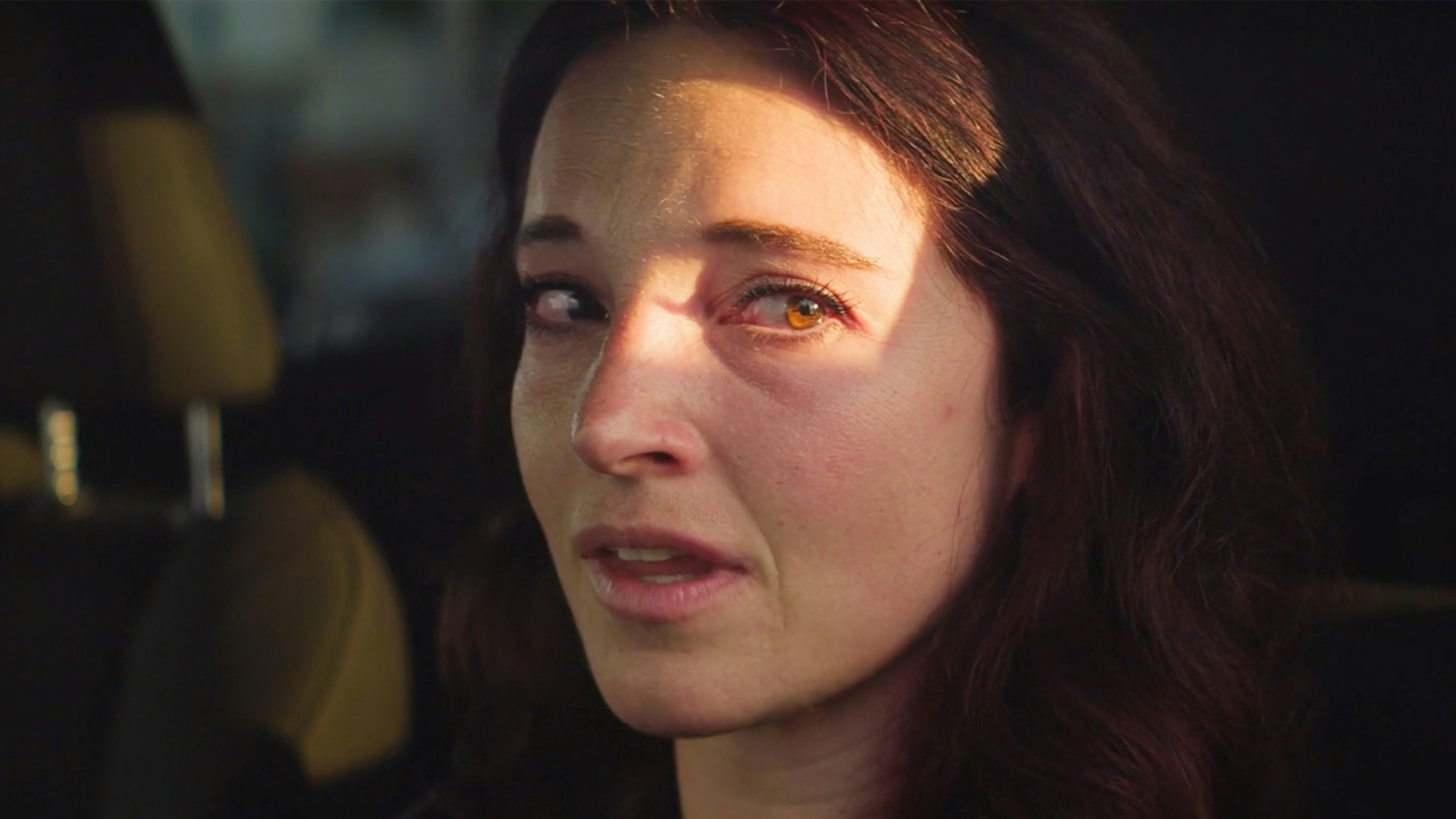 Woman with sunlight on her face inside car (Photo by tyler small on Unsplash)