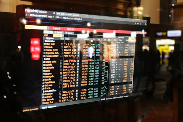 Financial stock market data and price figures displayed on a screen