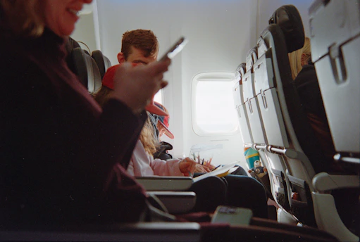 People traveling on an airplane during daytime