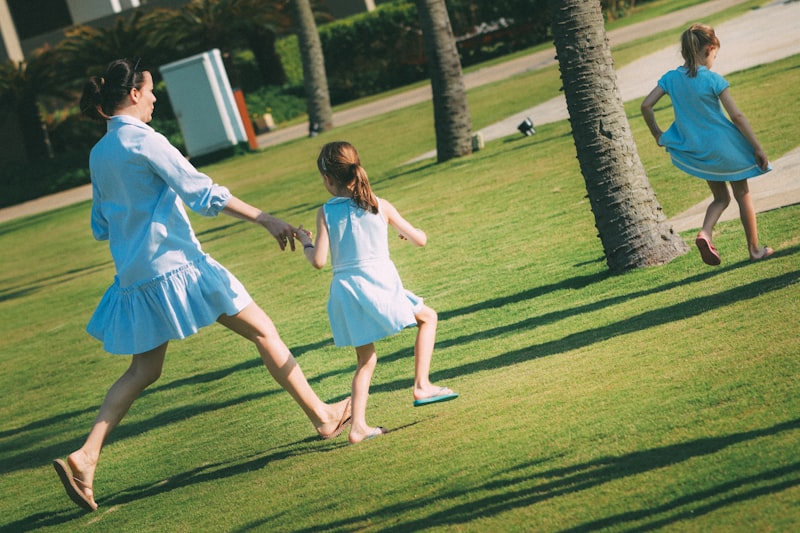 Mother and daughters playing