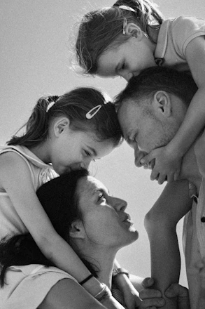 Family shares a tender moment together outdoors