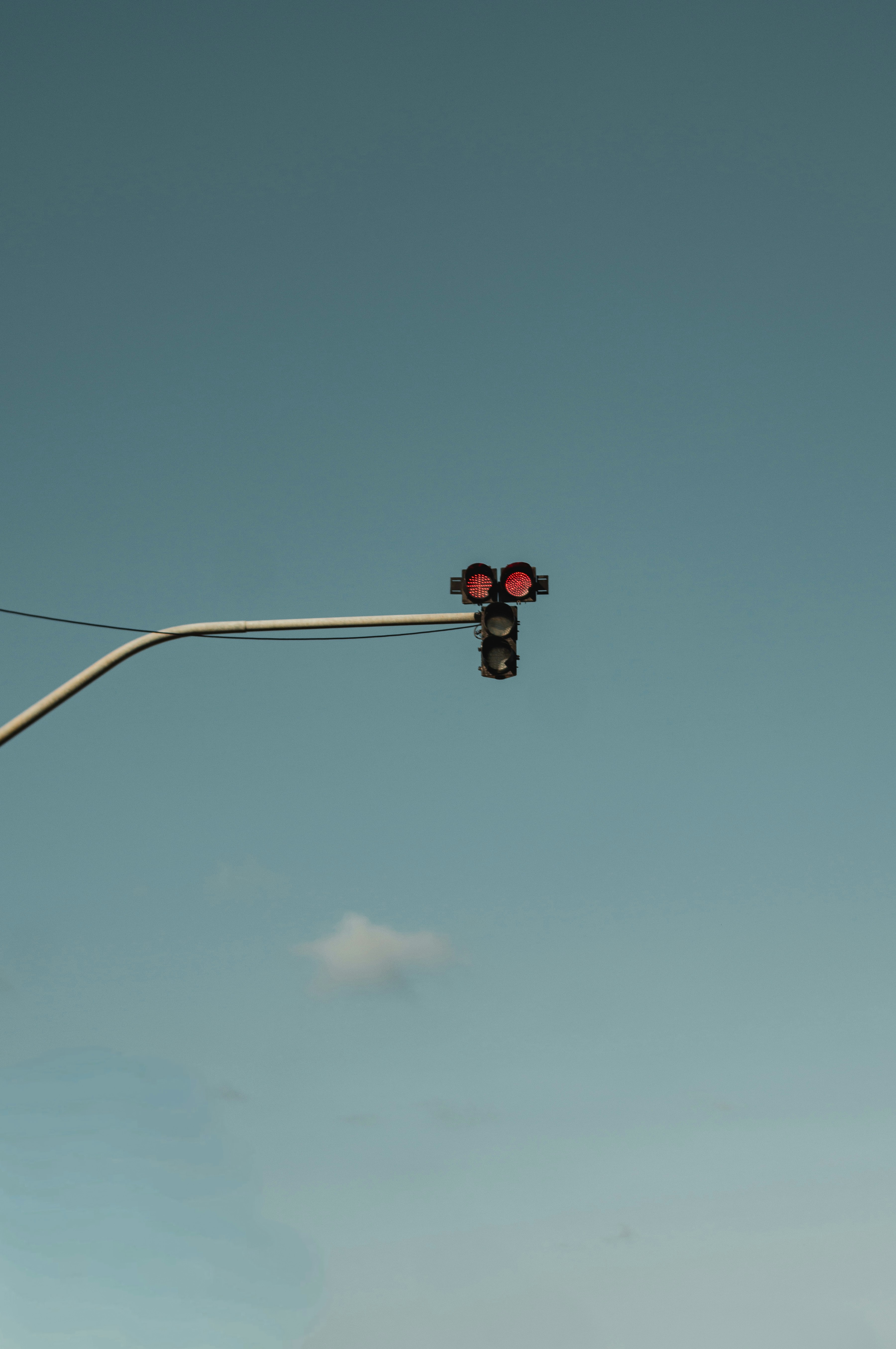 Traffic light against a clear blue sky