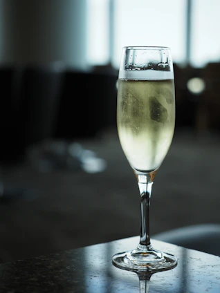 A glass of champagne on a table