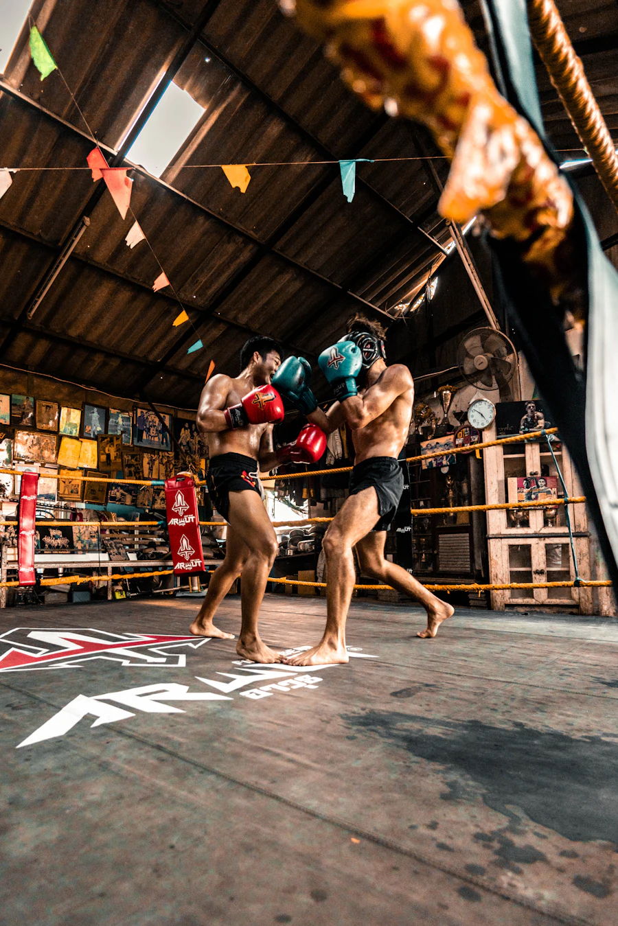 Two fighters sparring intensely in a ring