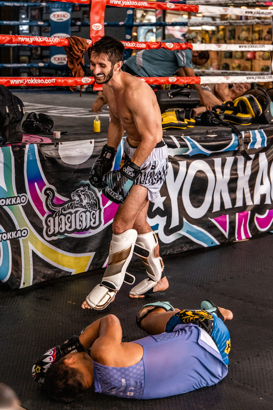 Combat sport athletes in a boxing ring after a match