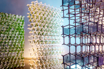 Three abstract geometric structures with hexagonal patterns