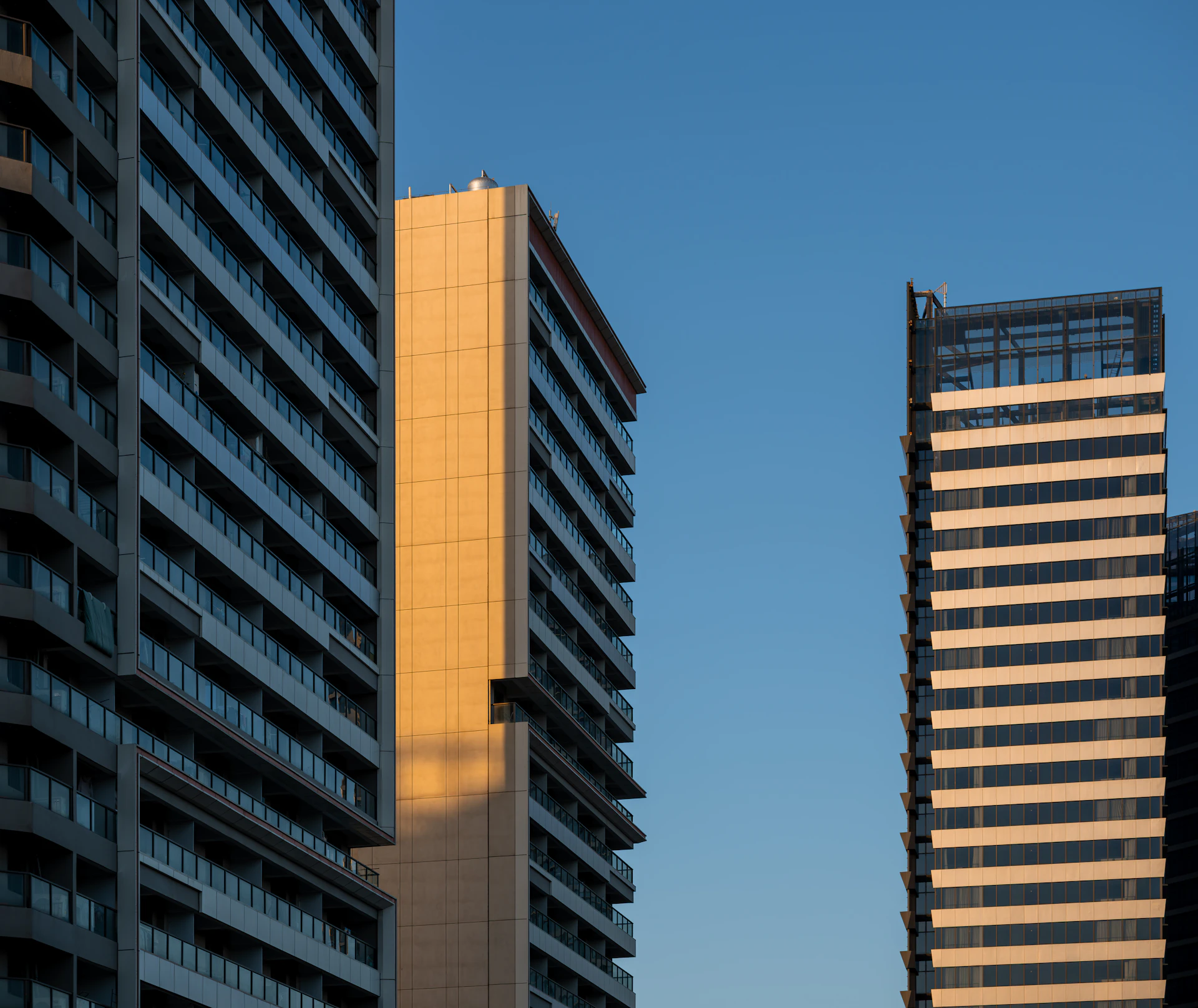 Luxury high-rise apartment towers at dusk