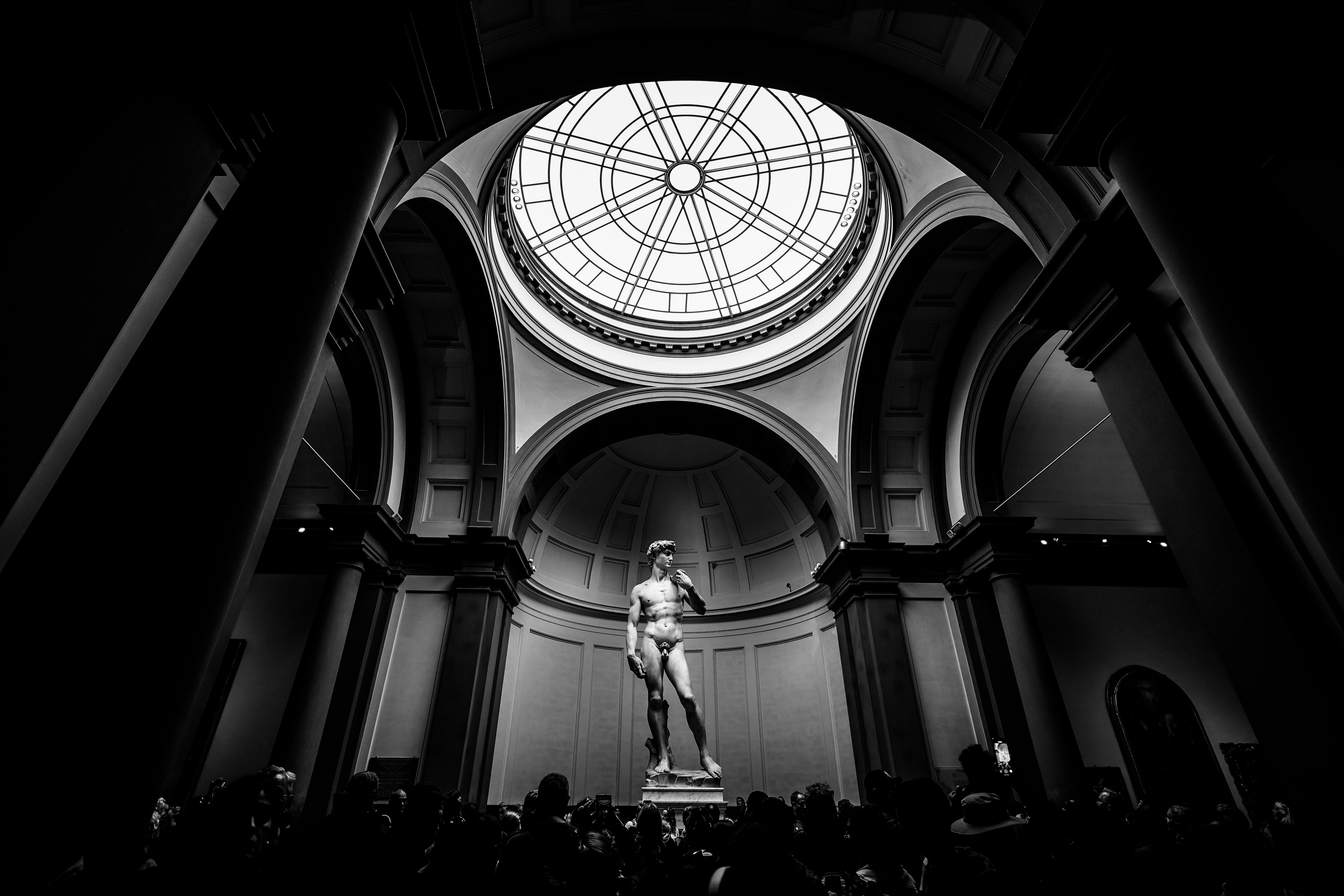 Statue of david in a grand museum rotunda