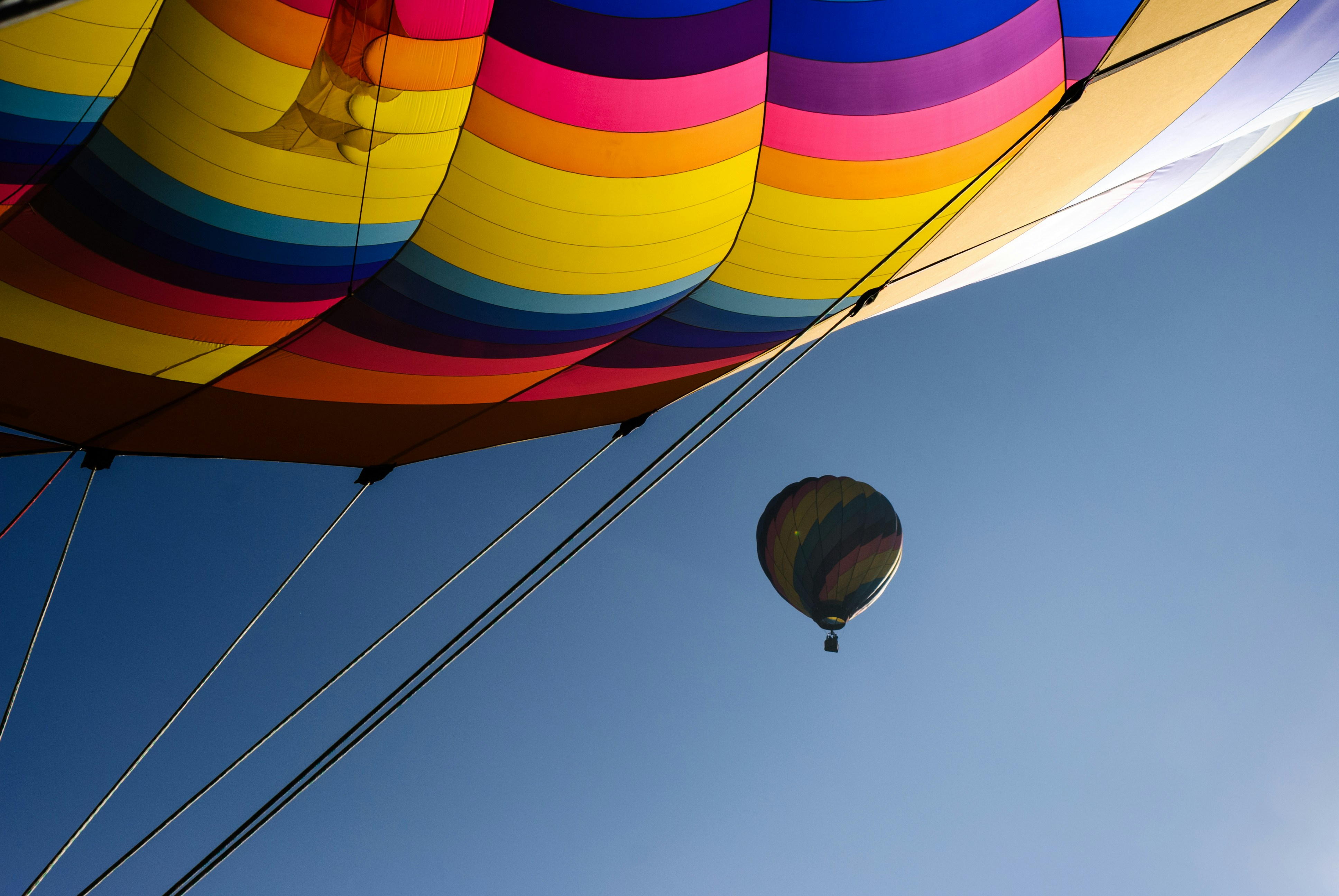 Colorful hot air balloon against a clear blue sky